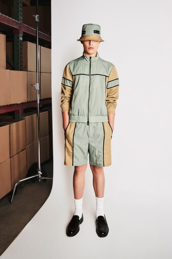 A relaxed fit green and beige color-blocked jacket paired with matching shorts.