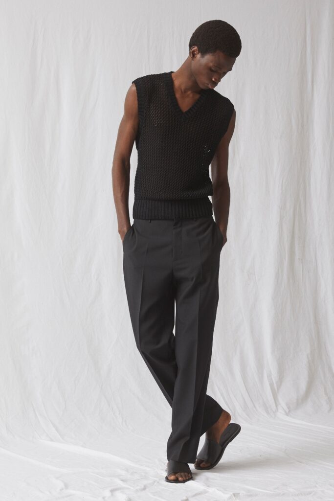 black fitted knit top and tailored pants