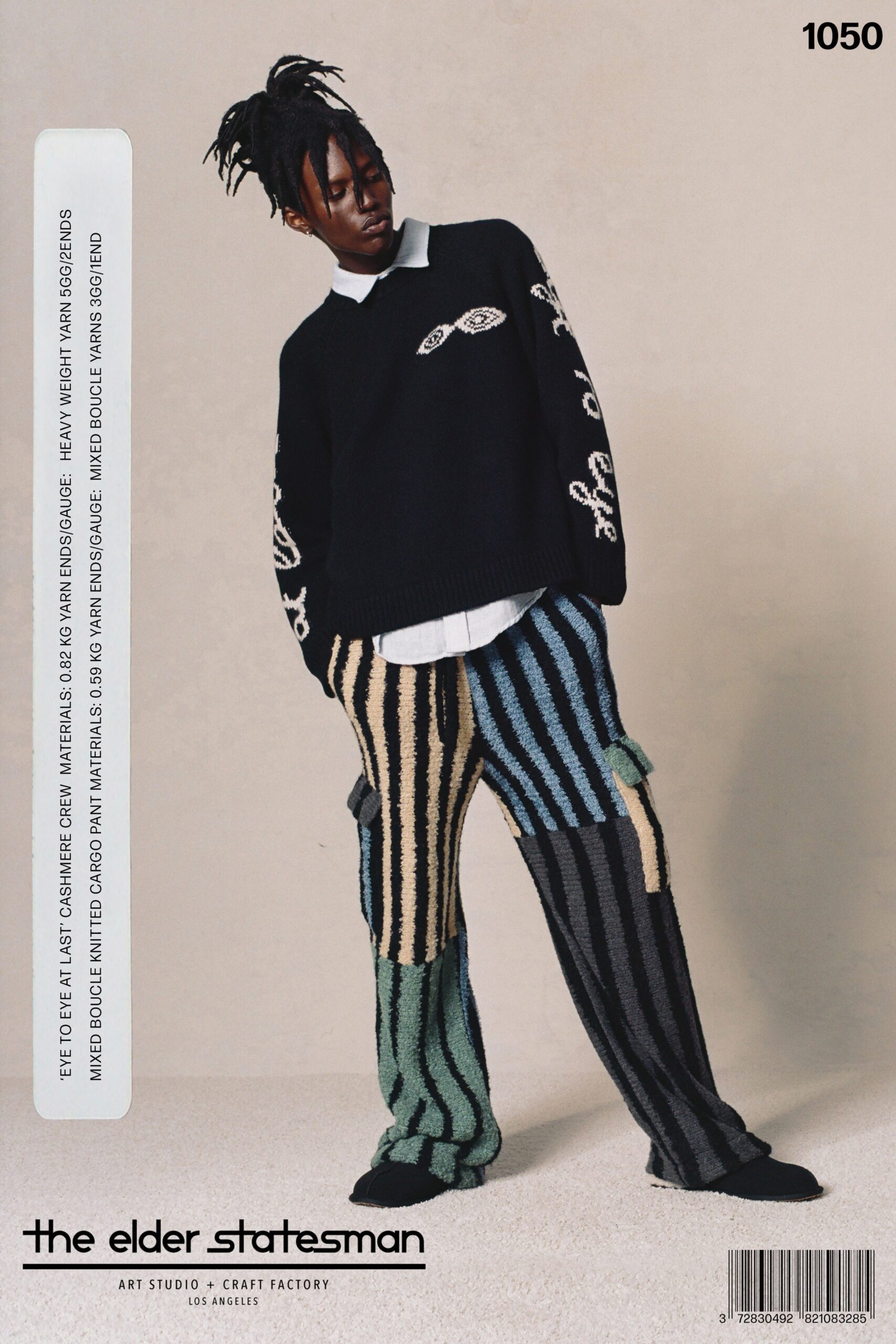 A relaxed black multicolor striped sweater paired with matching relaxed pants.