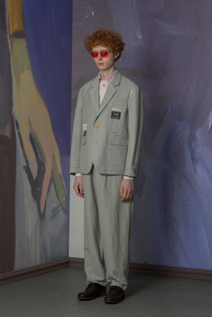 A relaxed gray cotton suit with a collared long-sleeve shirt and buttoned details.
