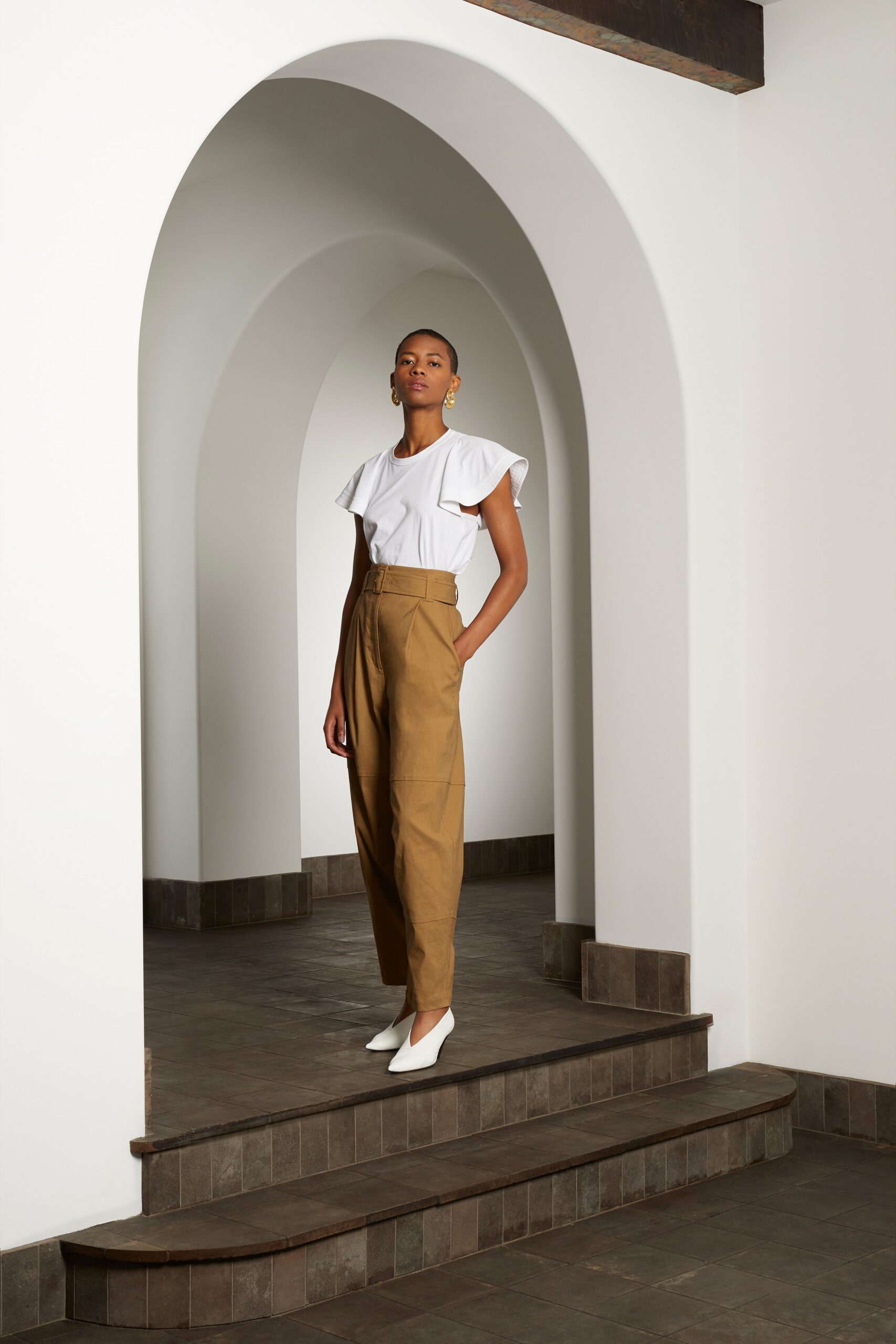 white ruffled top brown pants
