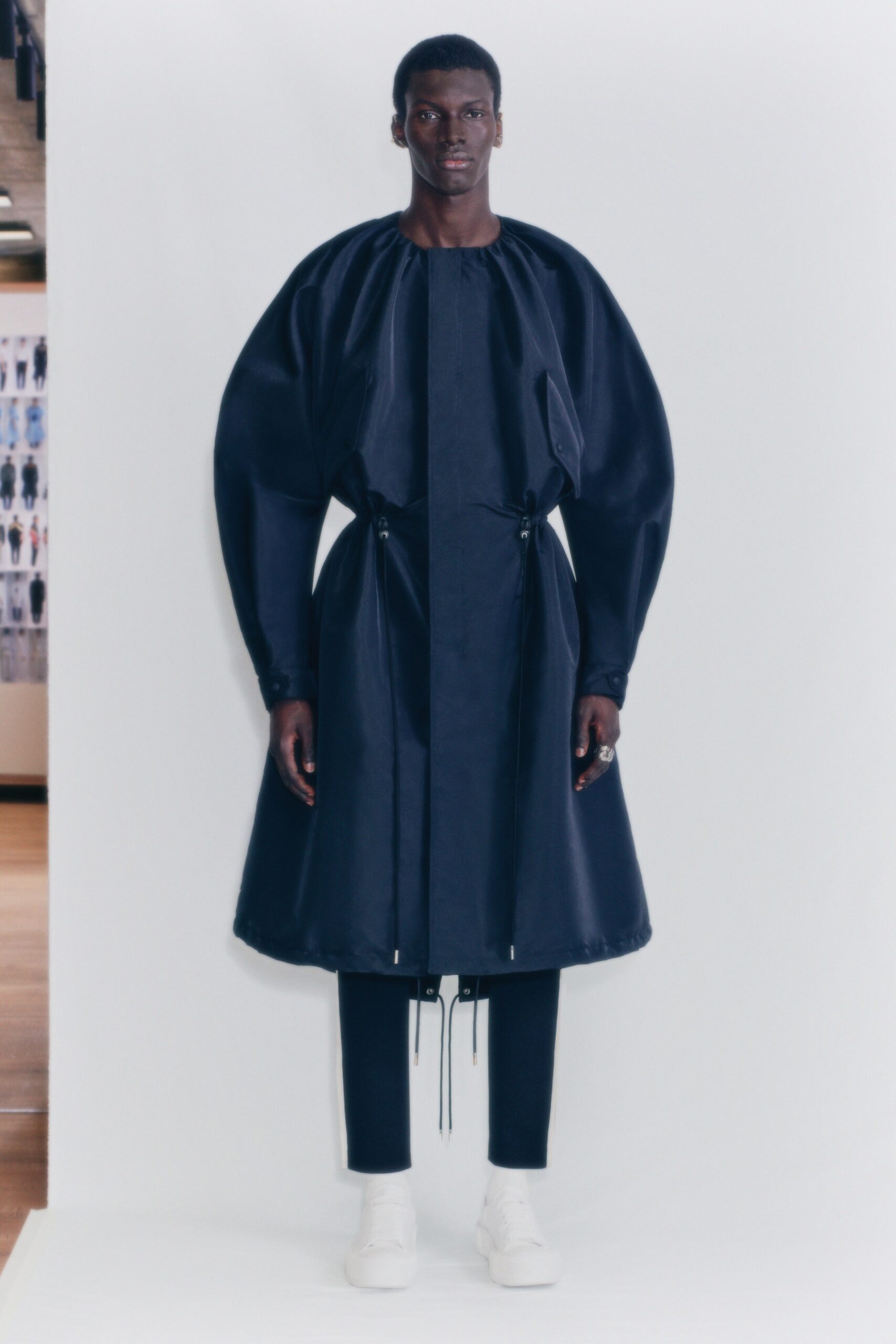 blue silk relaxed coat with black pants