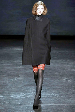 black wool asymmetric coat with red skirt
