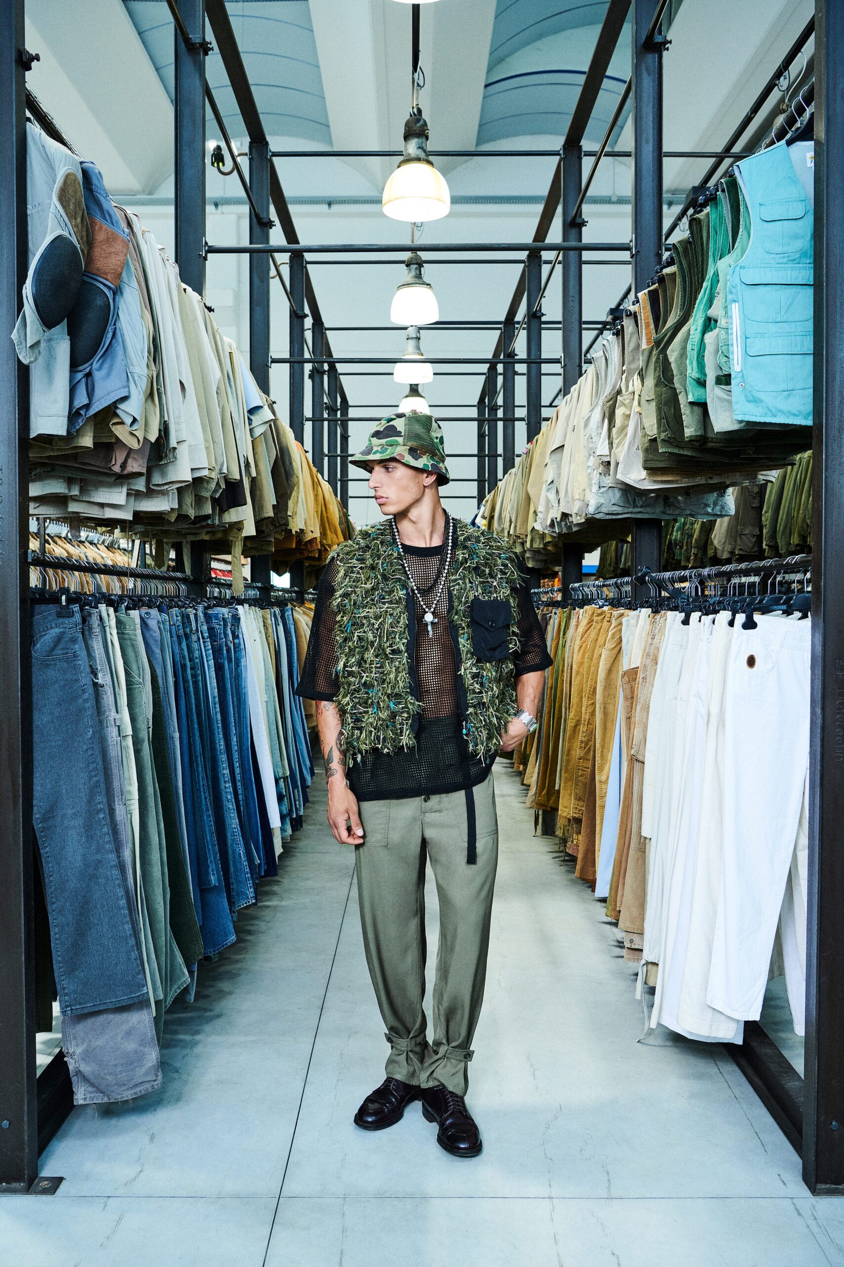 black mesh top with green vest