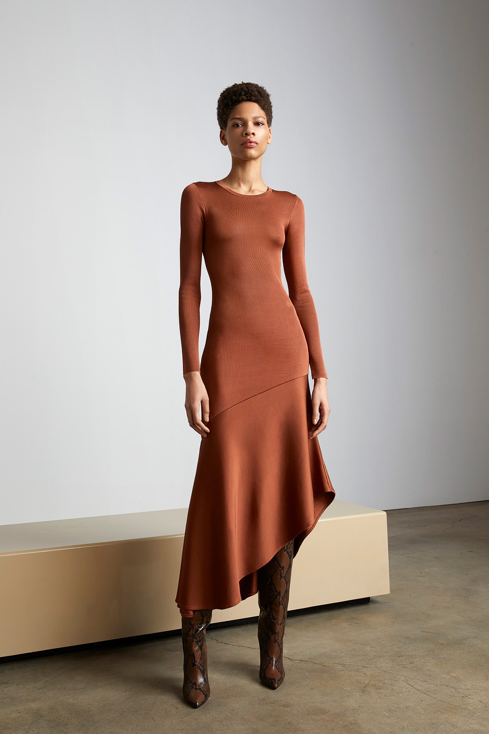 brown fitted asymmetric dress with boots