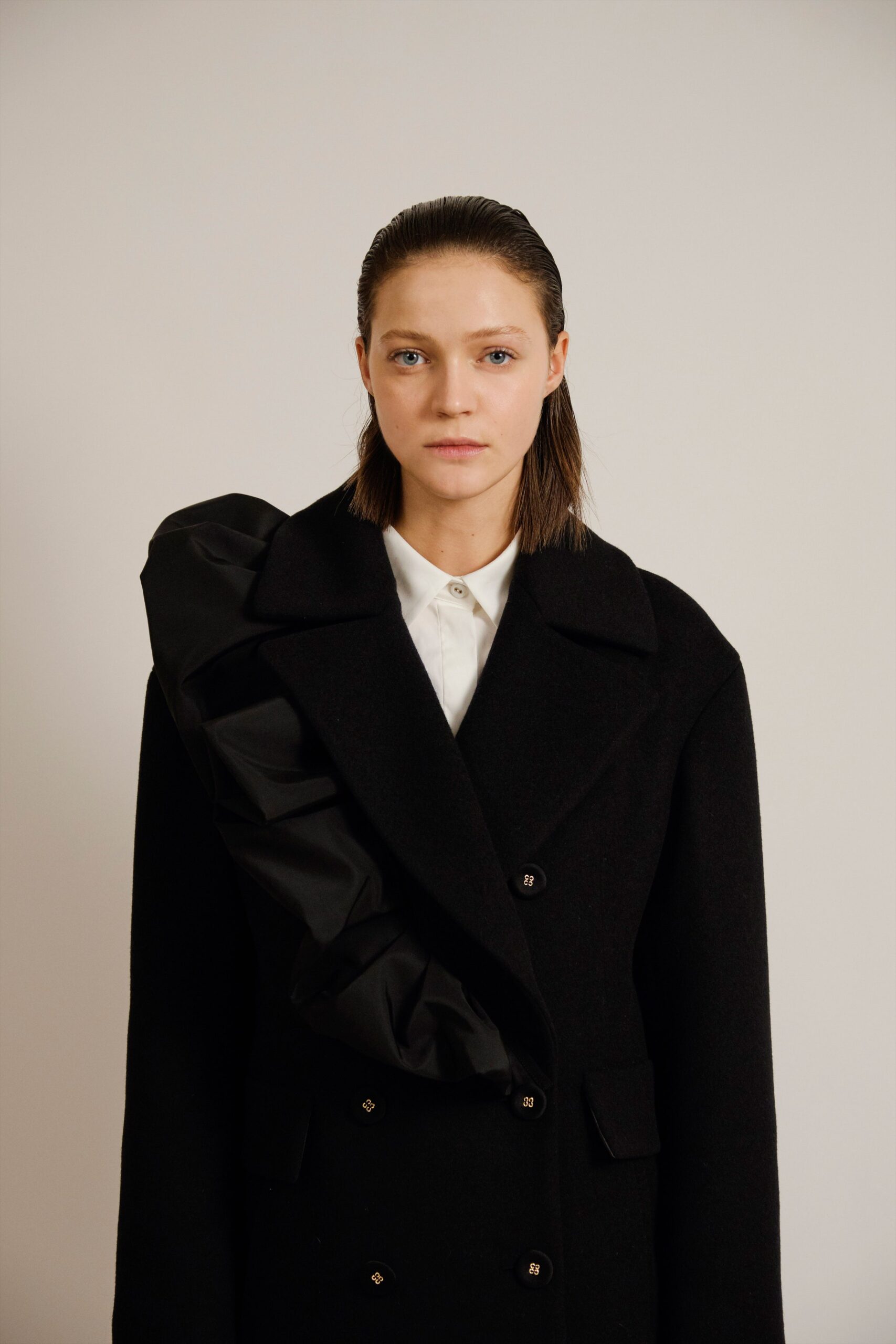 black wool long-sleeve collared fitted ruffled coat