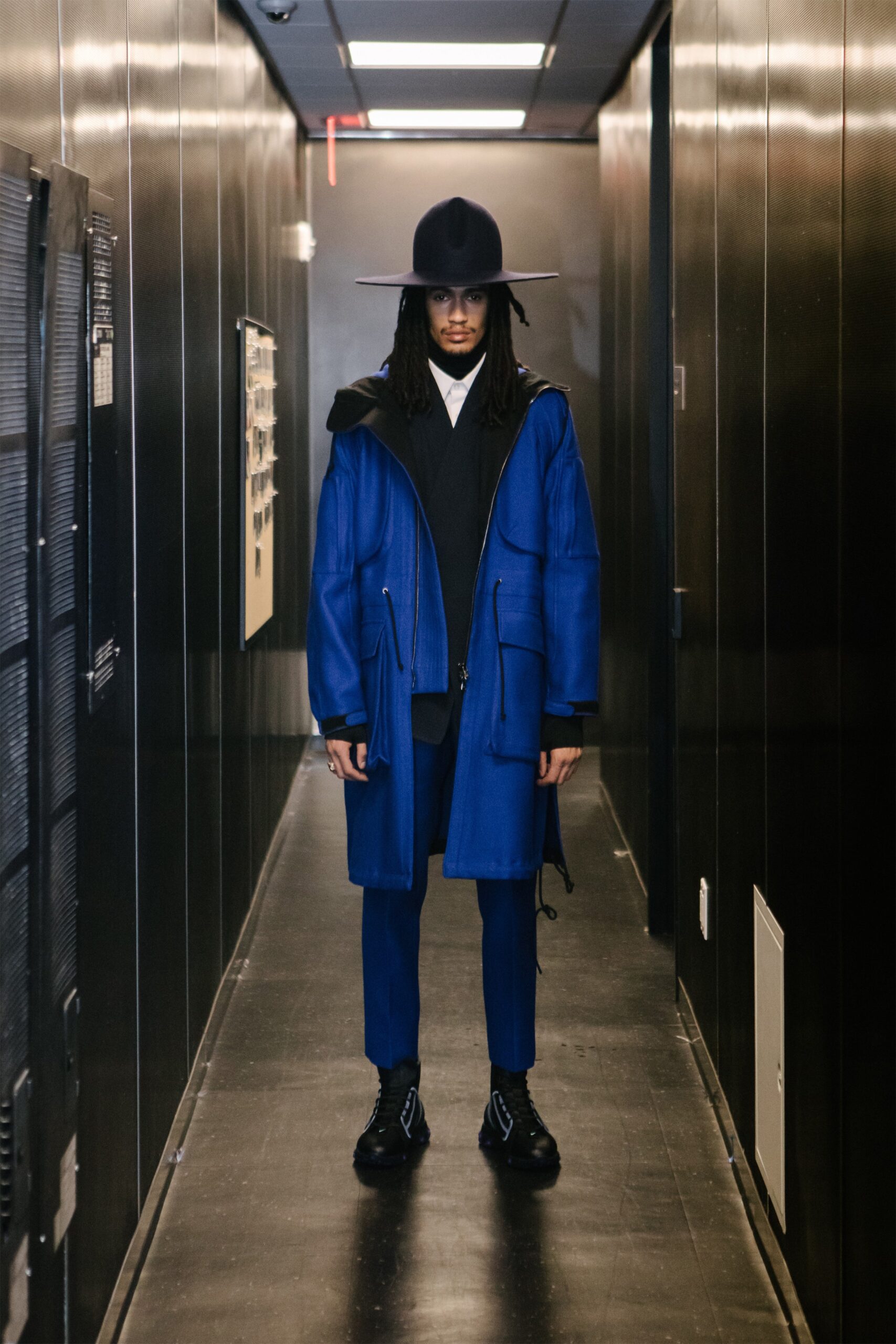 blue relaxed coat with tailored suit