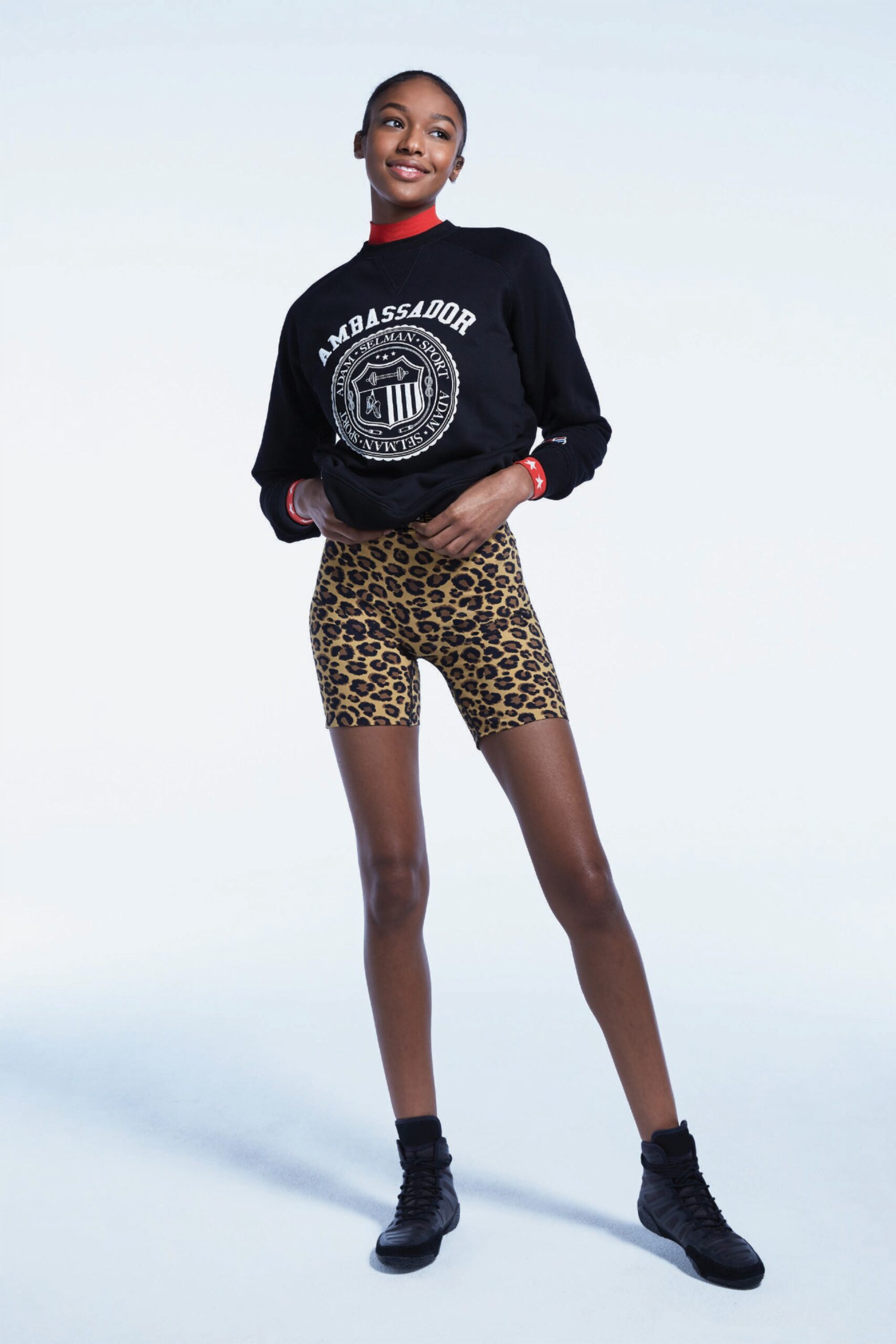 black fitted top and animal-print shorts