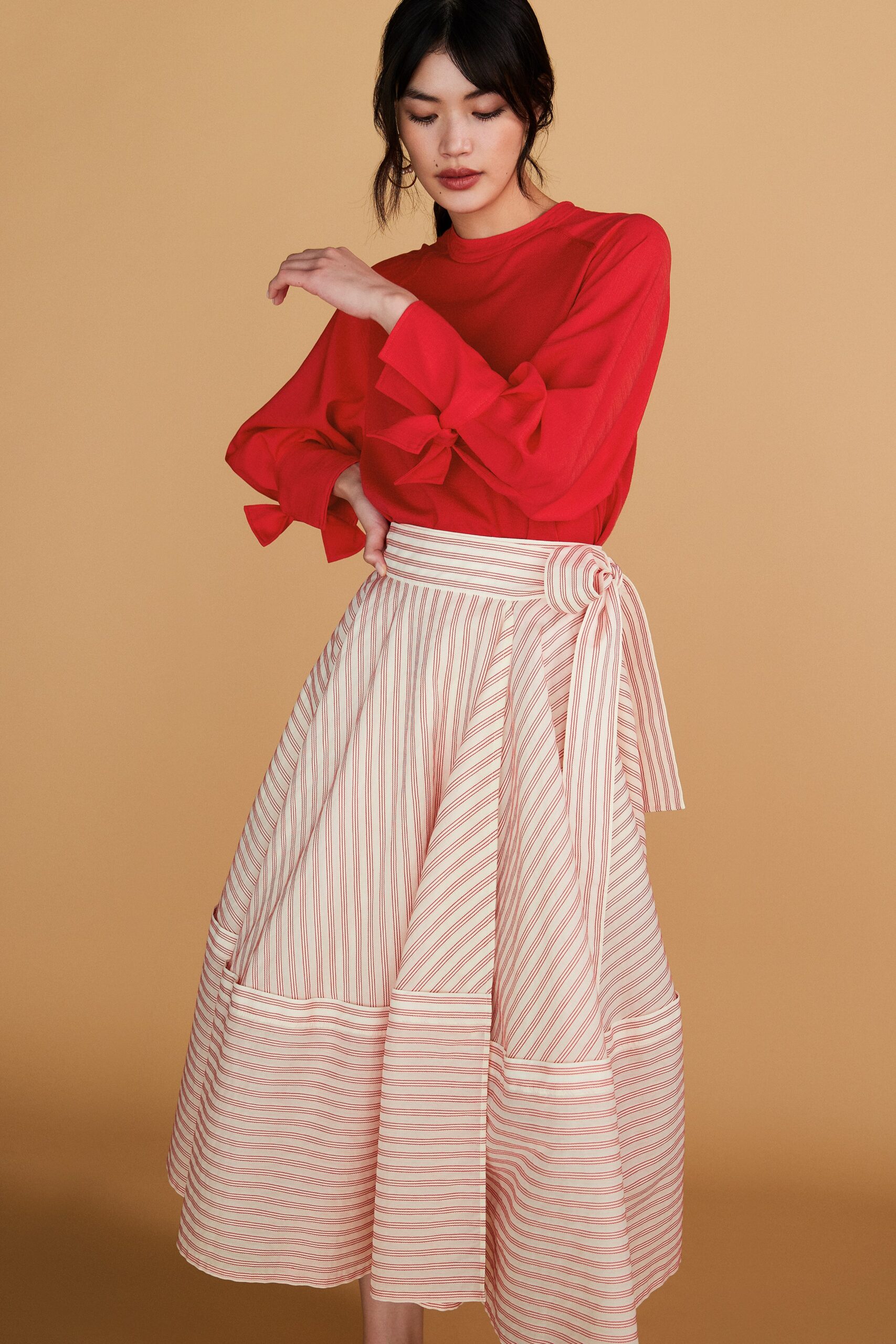red long-sleeve collared fitted ruffled top