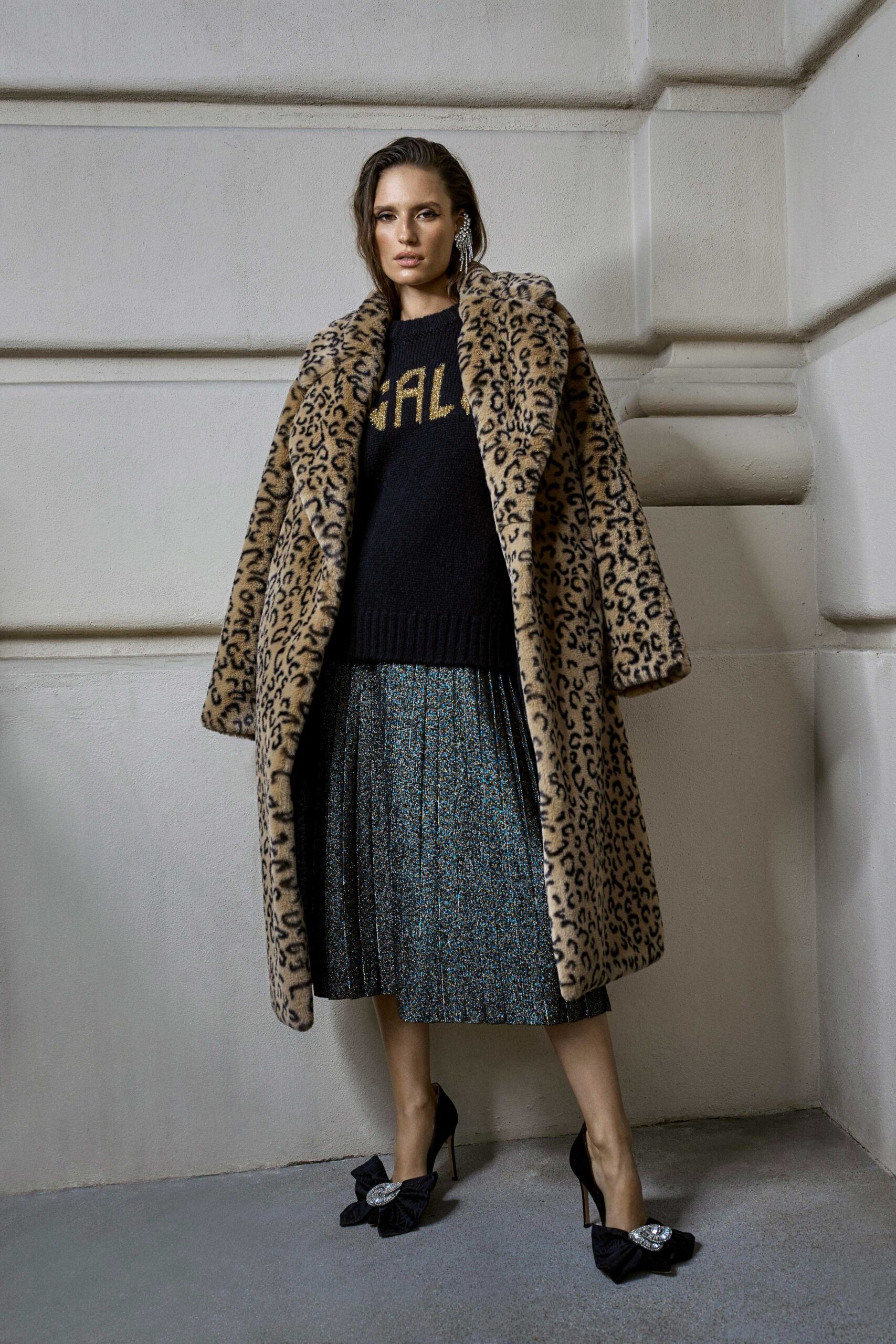 brown faux-fur coat with black sweater