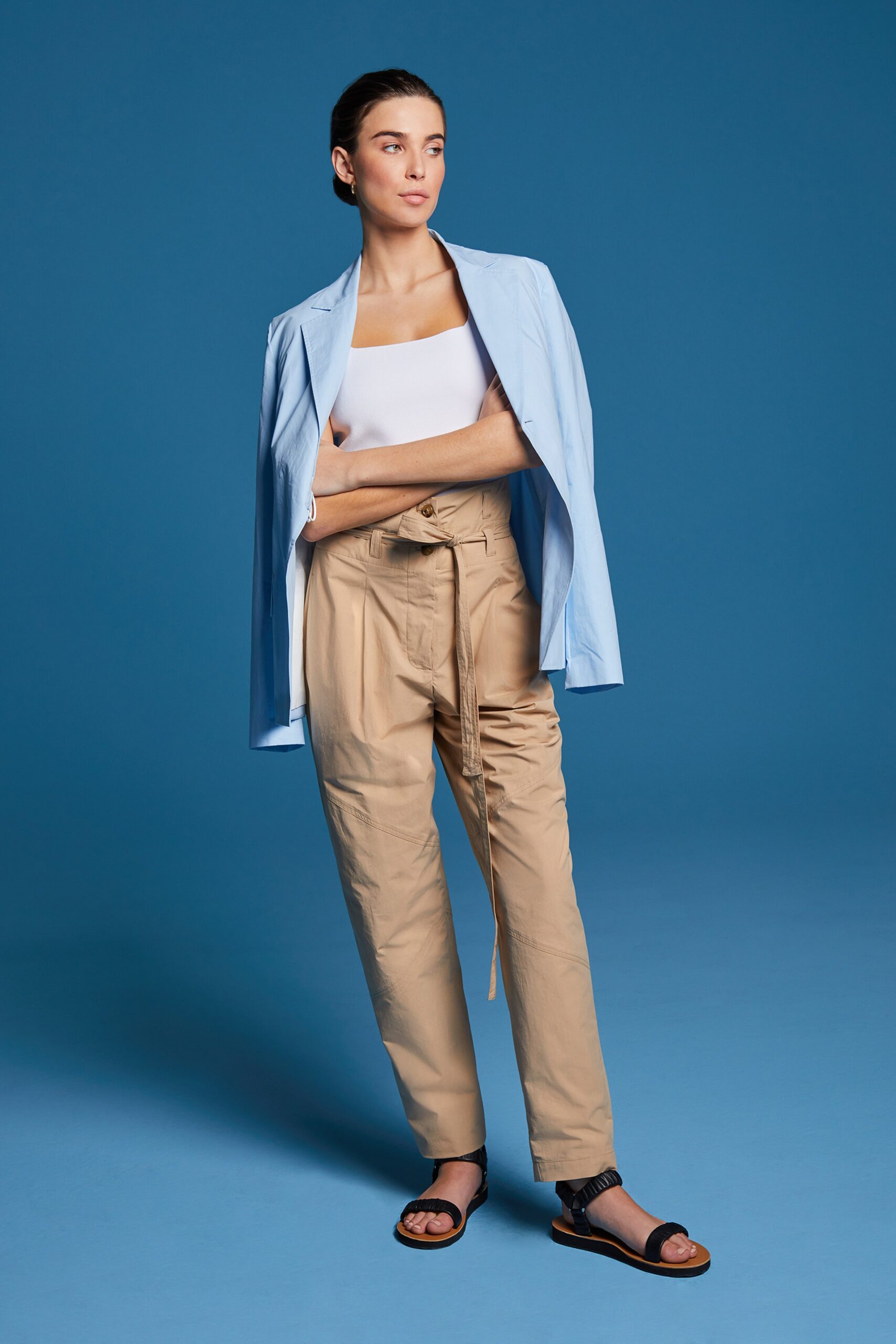 blue tailored blazer with beige pants