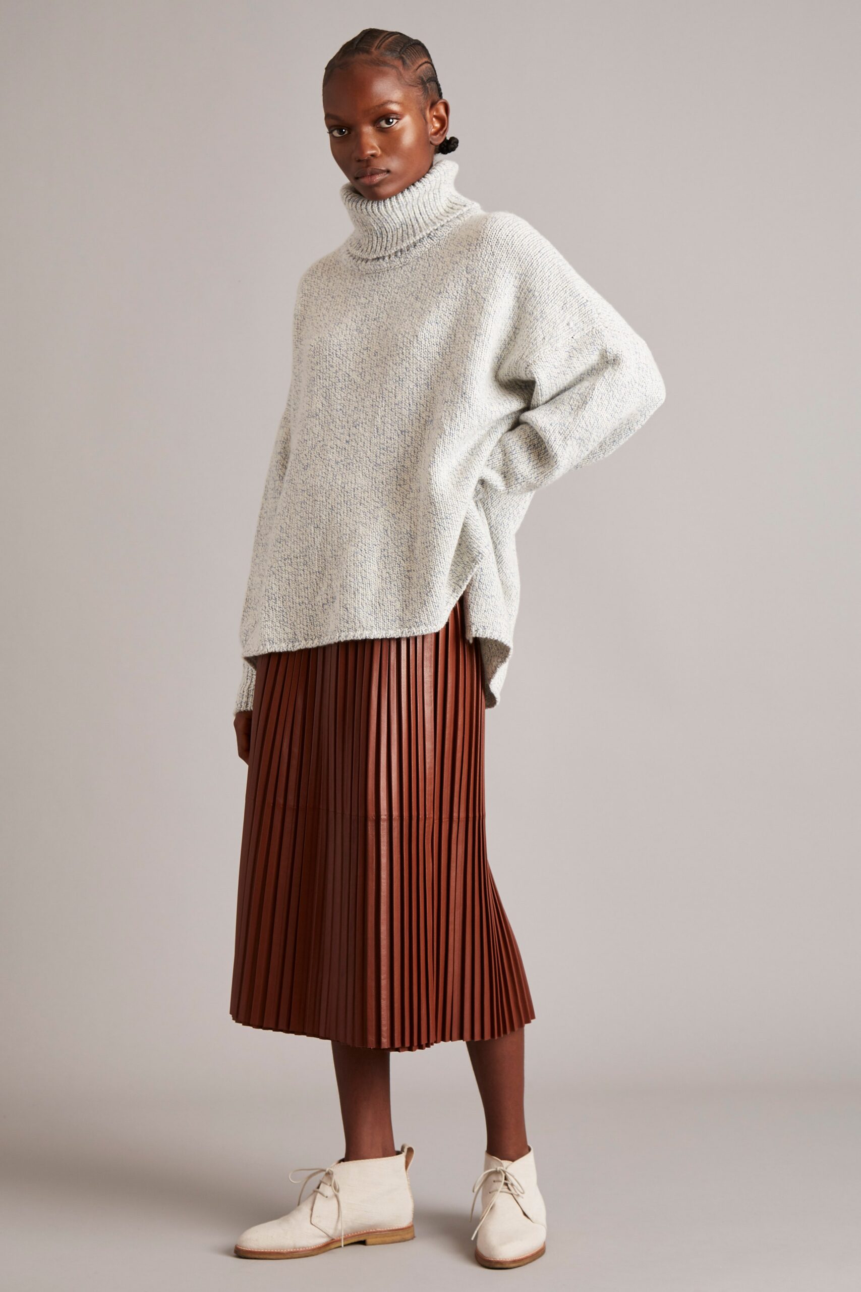 gray oversized sweater and brown pleated skirt