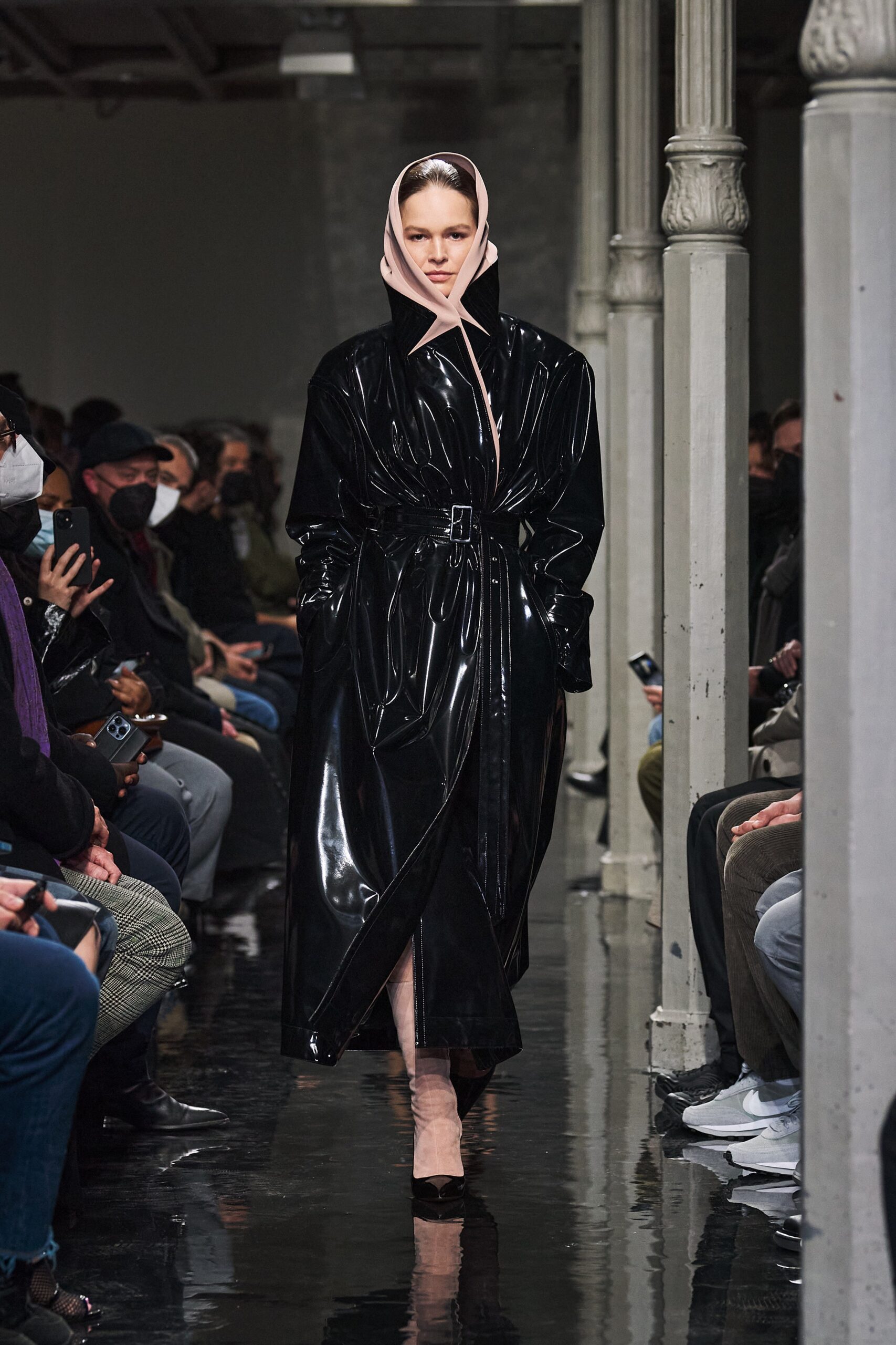 black vinyl belted coat