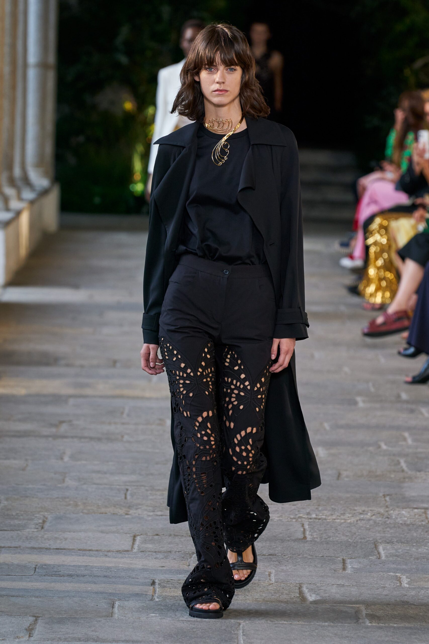 black coat and cutout pants