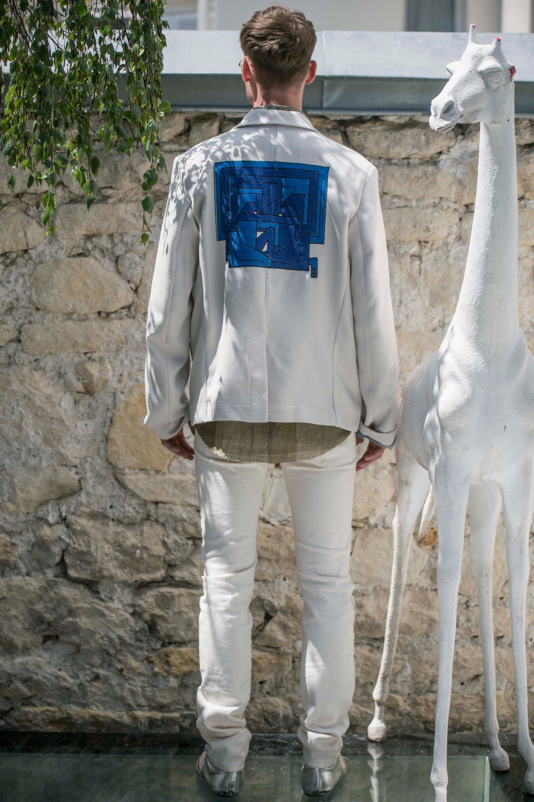 white relaxed blazer with blue embroidery