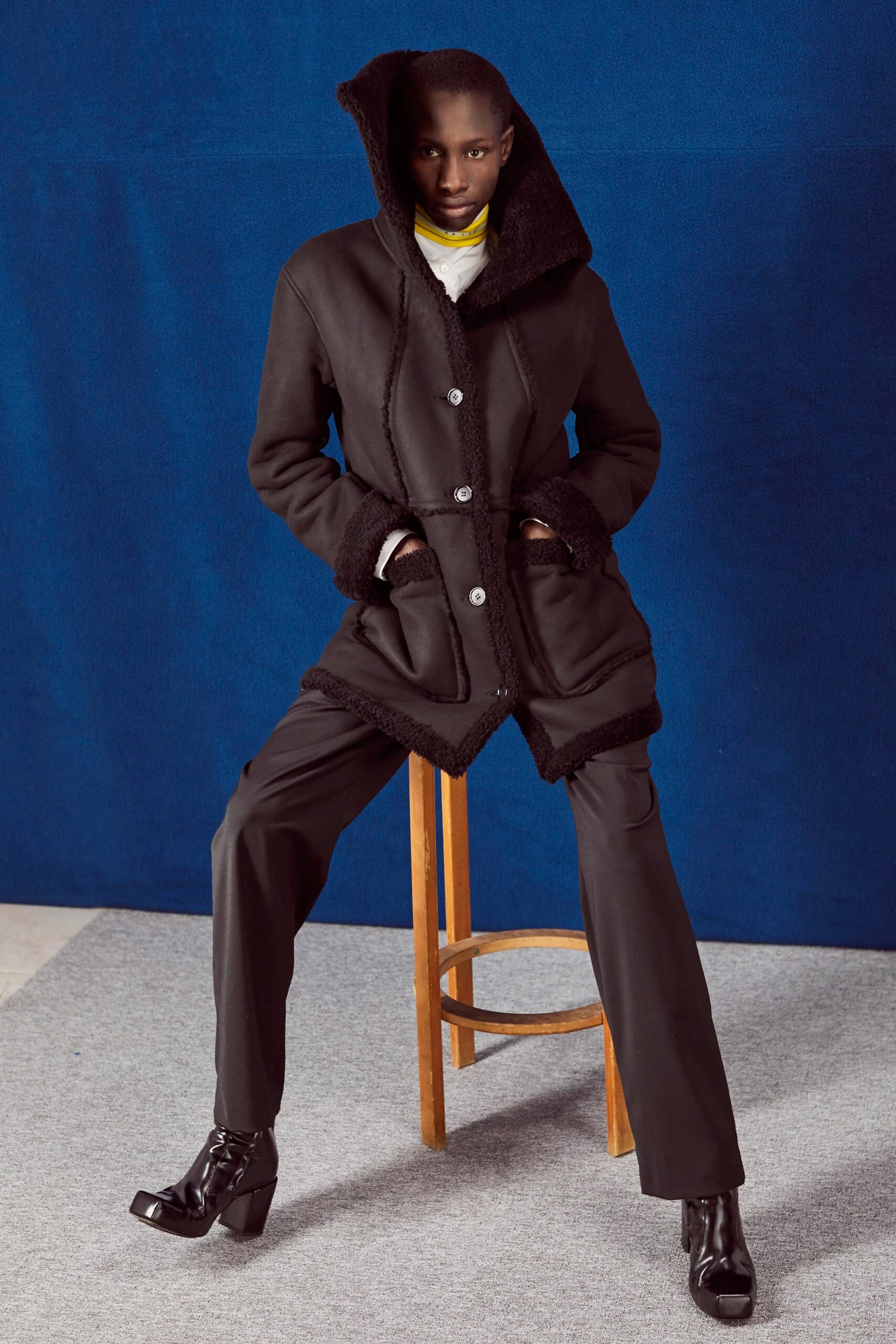 black wool coat with tailored pants