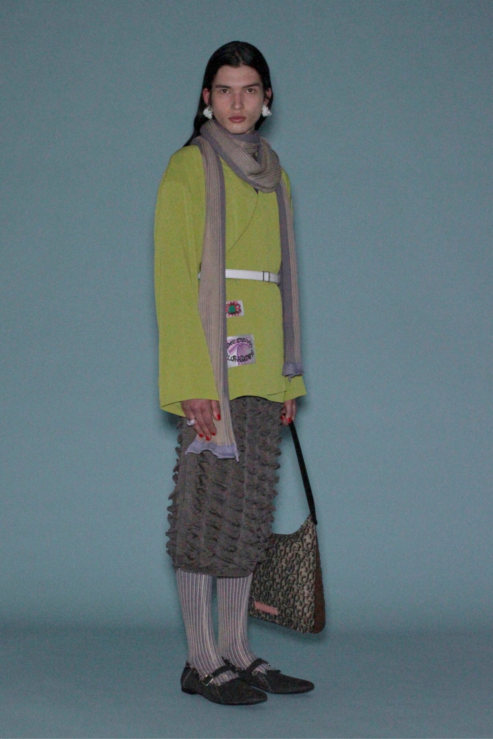 green relaxed top with gray pleated skirt