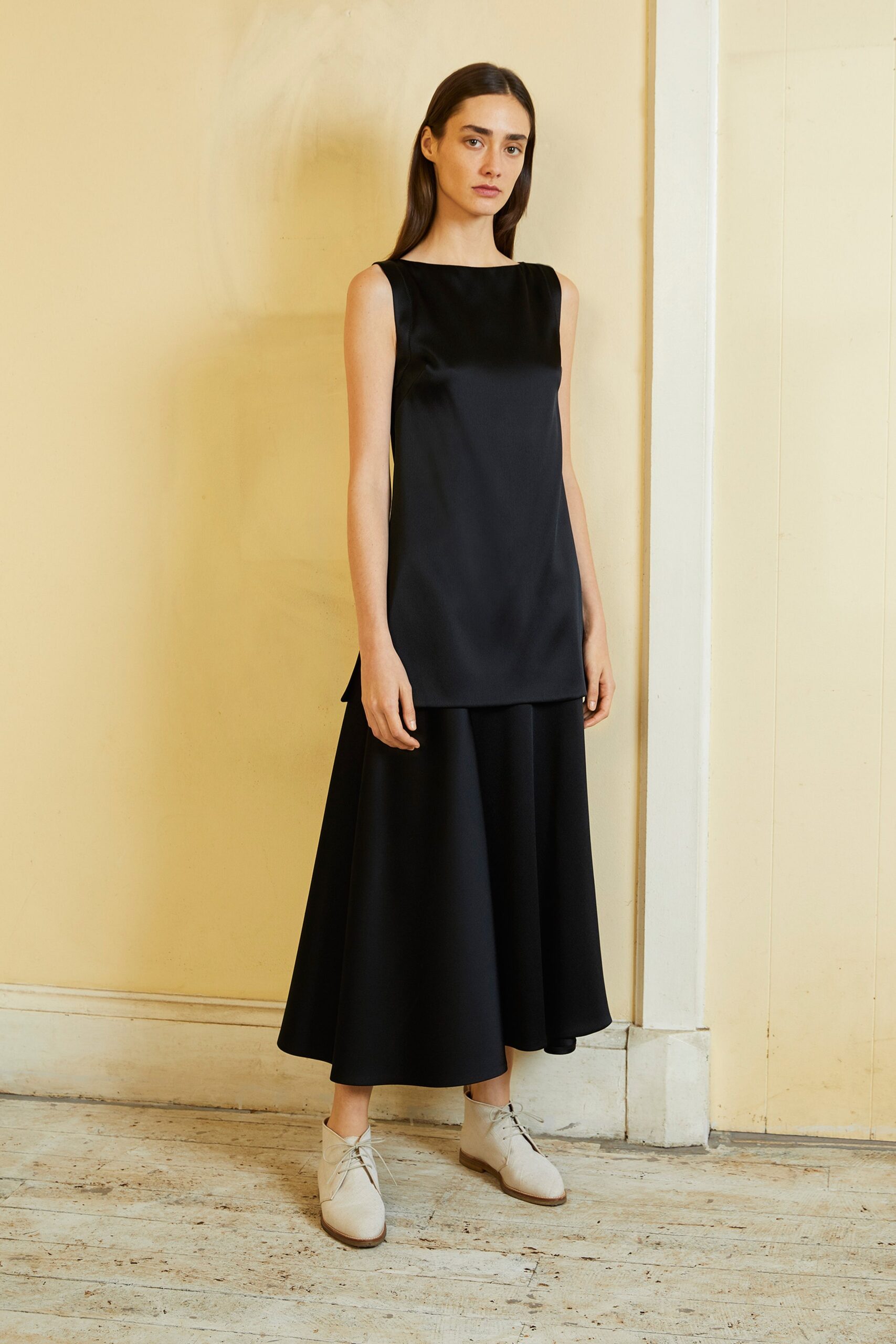 black silk sleeveless top and midi skirt