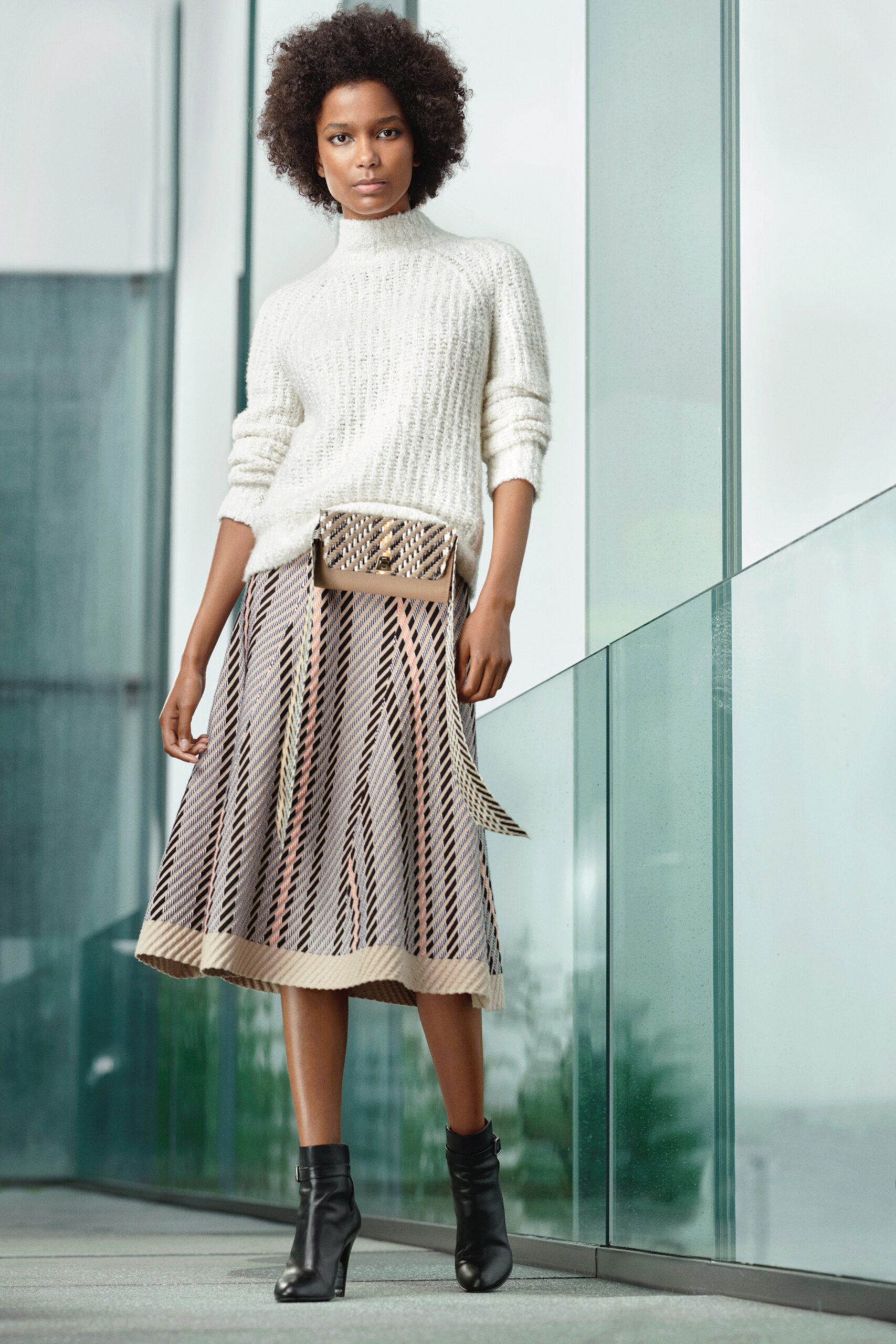 white wool turtleneck sweater with pleated midi skirt