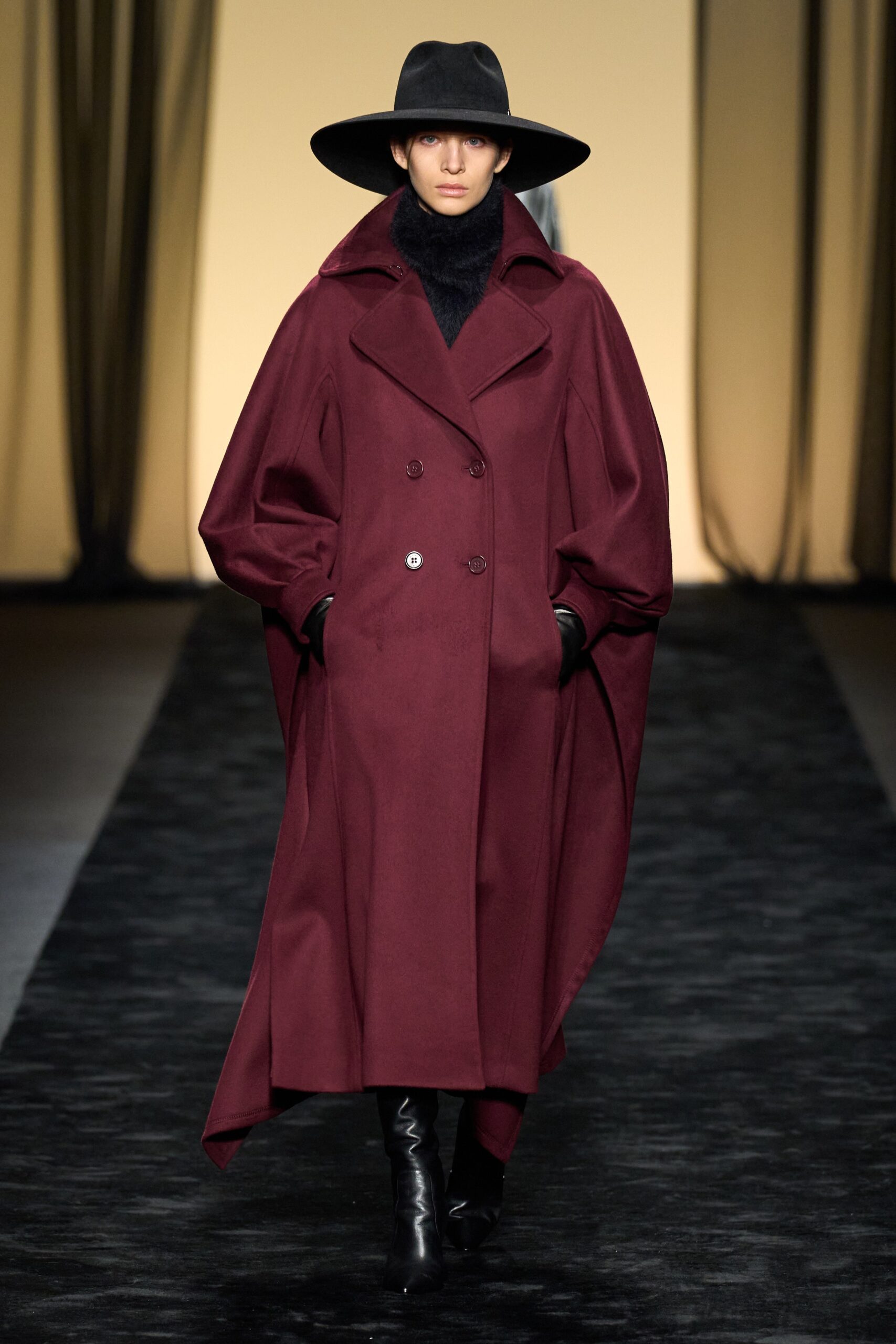 oversized maroon wool coat with black hat