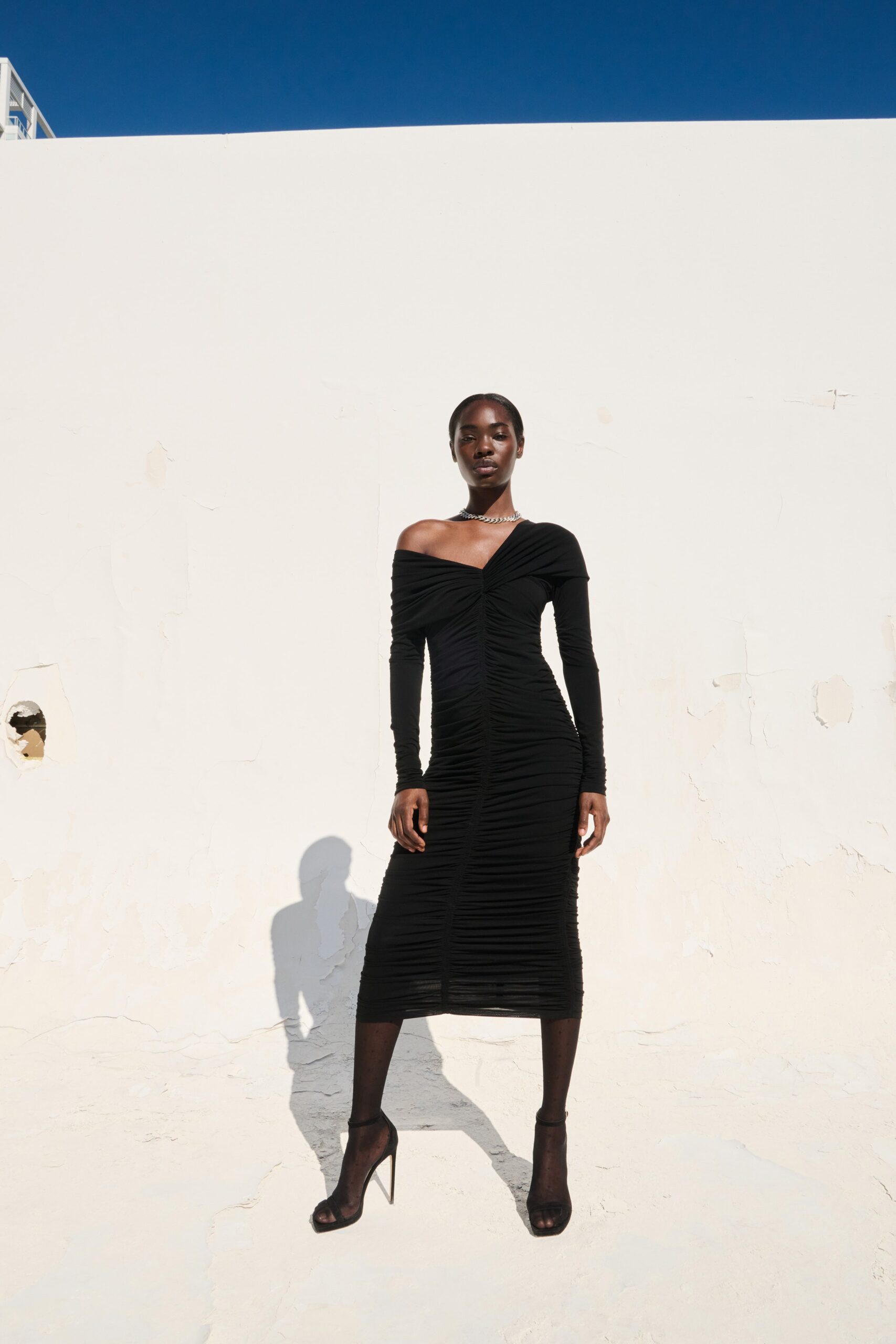 black fitted off-shoulder dress
