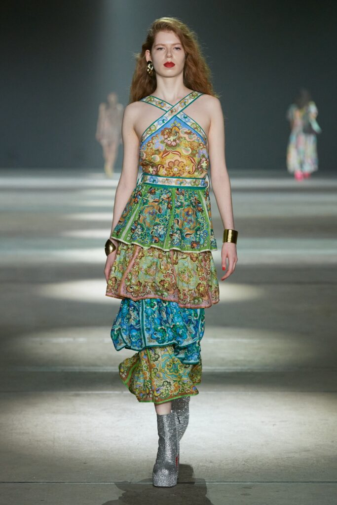 A fitted multicolor silk sleeveless dress with a V-neckline and tiered design.