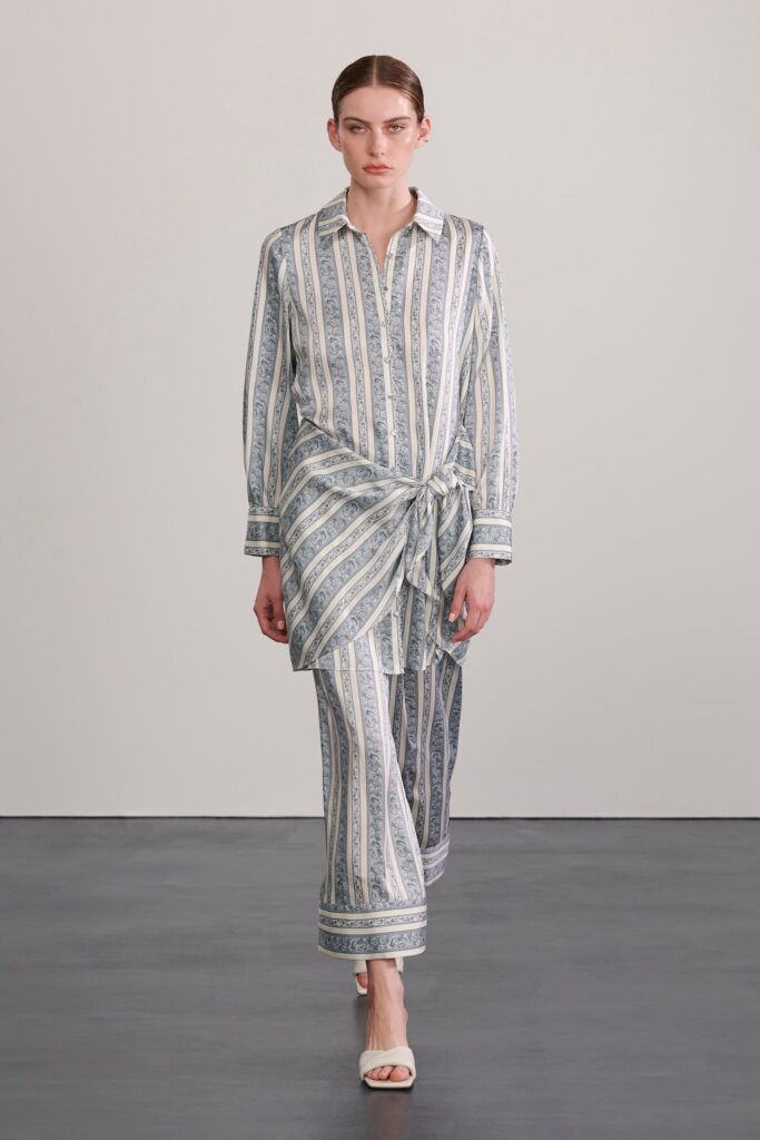 A relaxed fit blue and white striped long-sleeve shirt paired with matching pants.