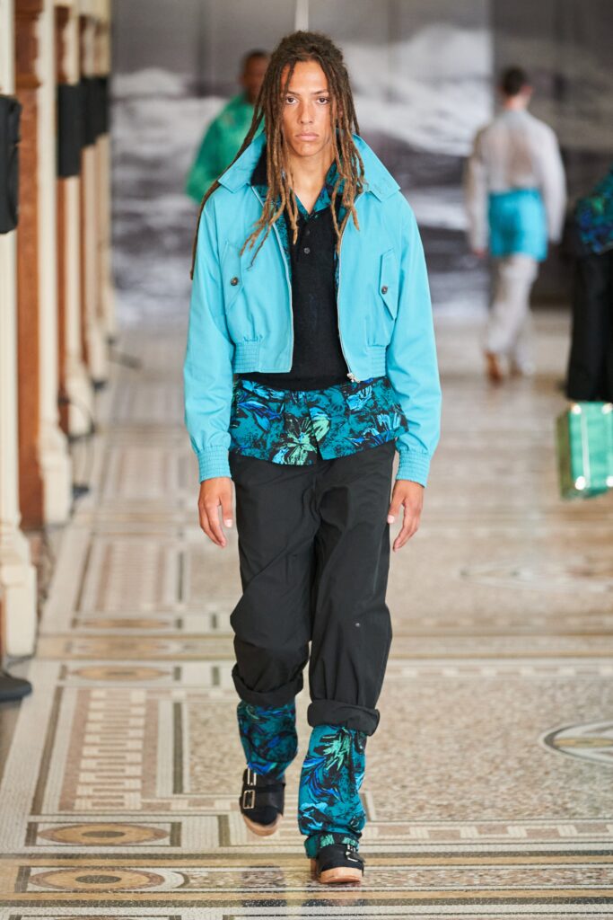 blue jacket black shirt cargo pants