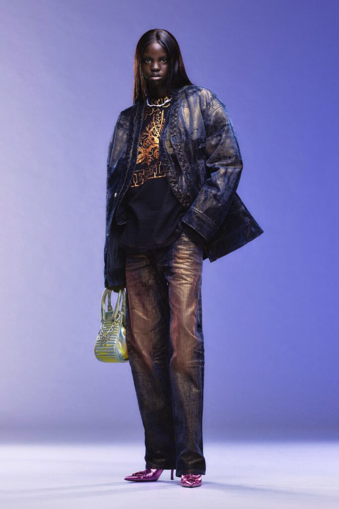 A relaxed blue denim jacket paired with straight-leg denim pants.