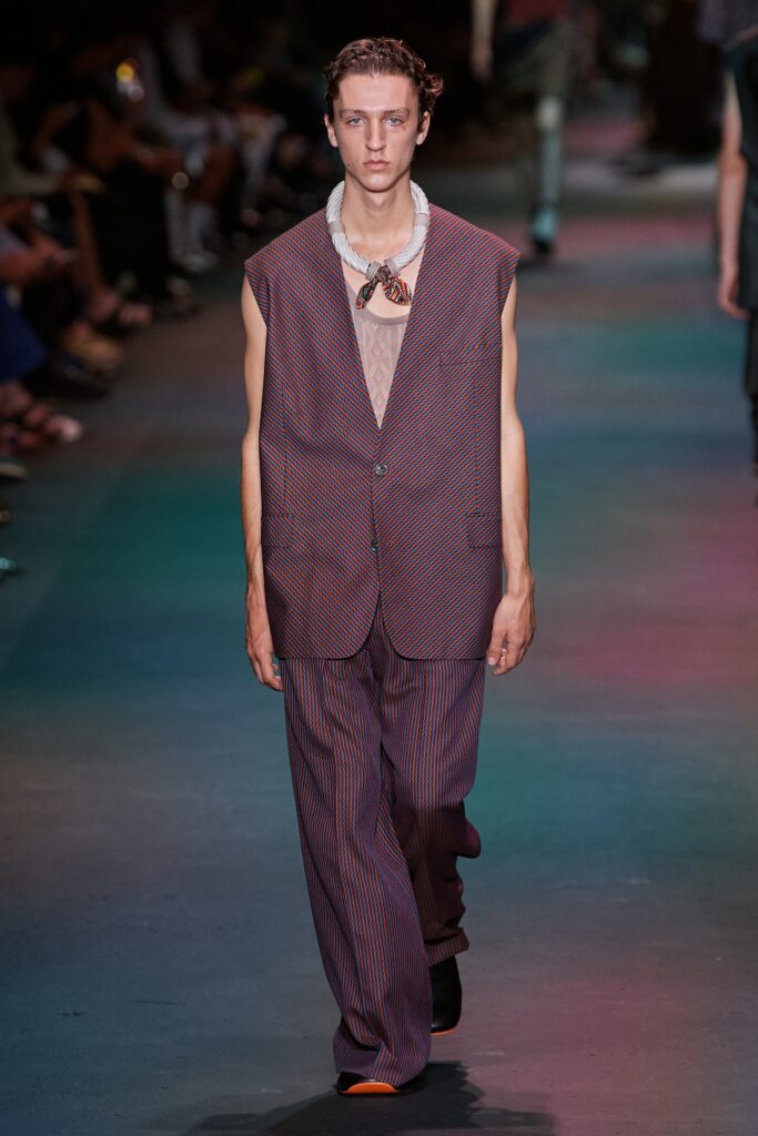 A relaxed fit striped suit with a sleeveless collared top and matching trousers.