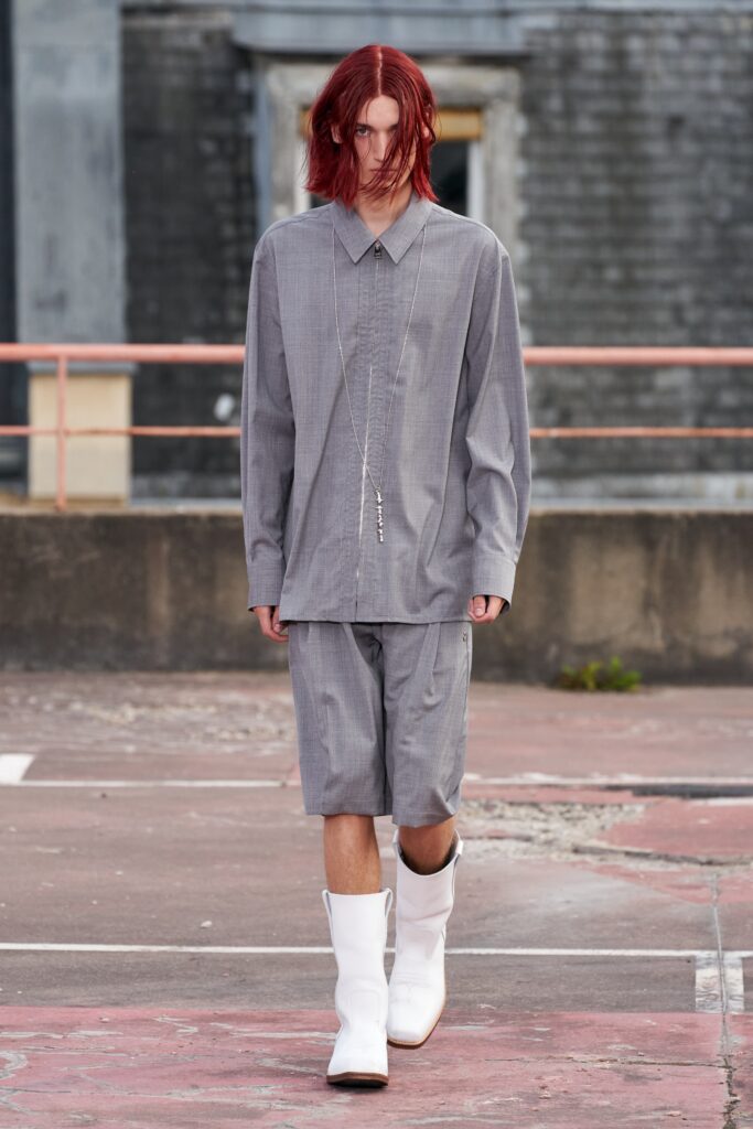 A relaxed gray cotton long-sleeve shirt paired with matching shorts featuring a buttoned design.