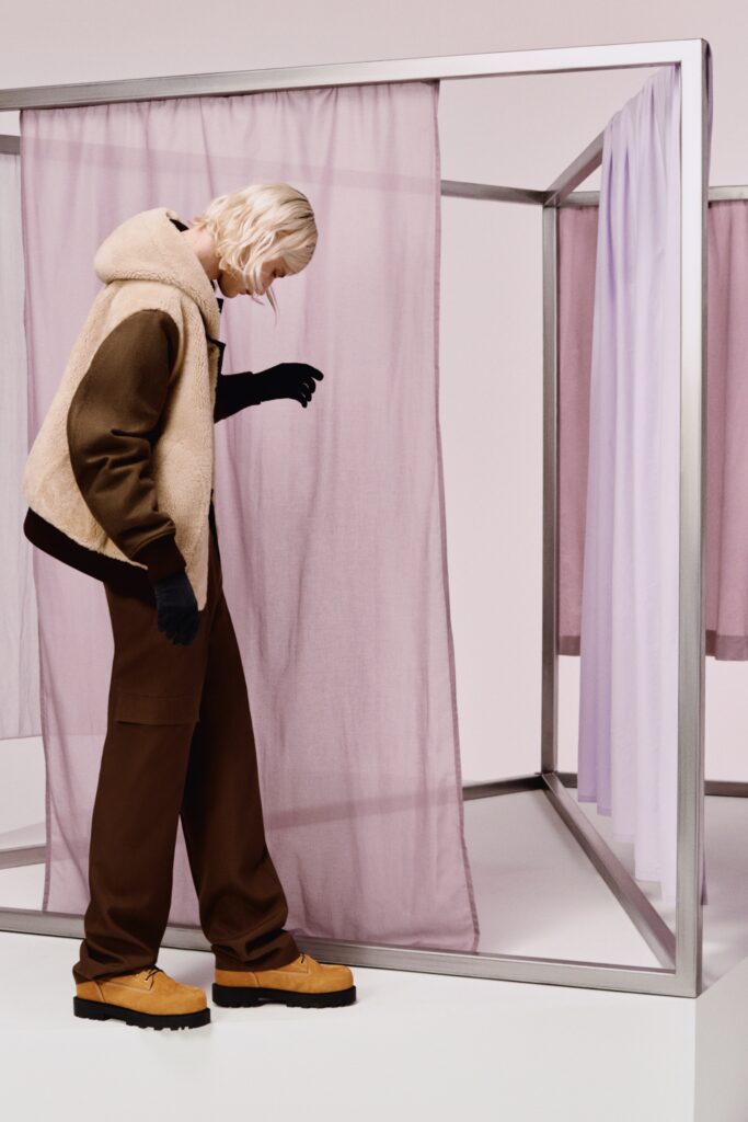 A relaxed brown wool jacket with long sleeves and matching pants, featuring a zippered detail.