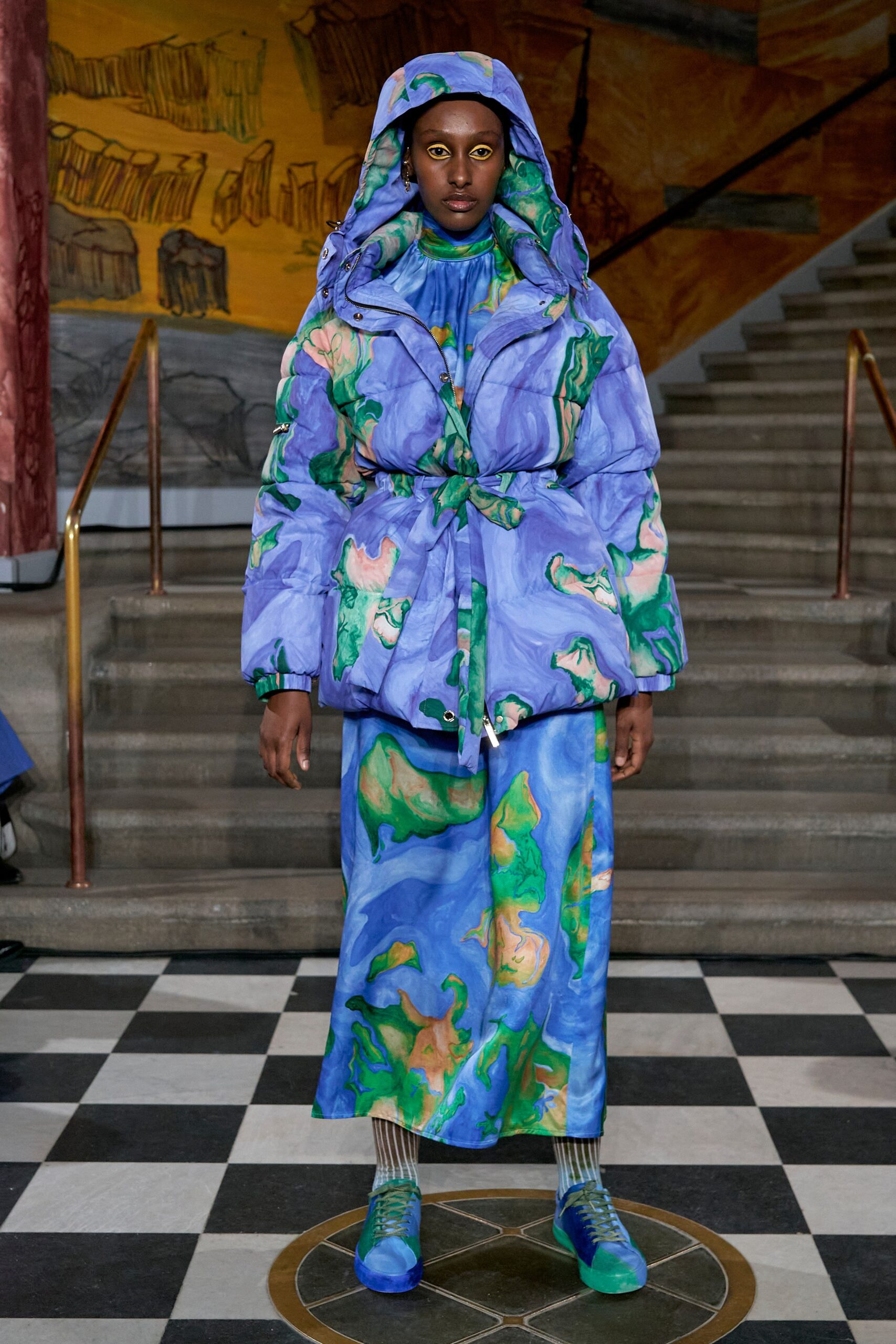 A relaxed blue and green printed coat dress with long sleeves and a collared neckline.
