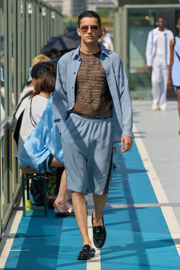 A relaxed blue cotton shirt with a printed brown top and matching shorts.