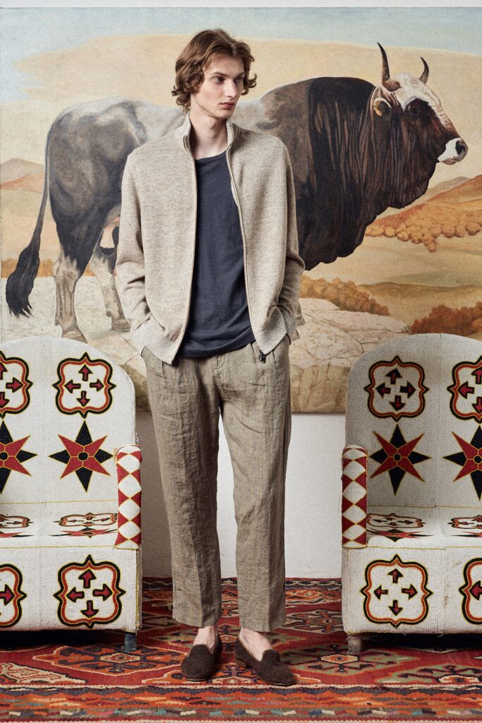 A relaxed beige cotton jacket paired with gray linen straight-leg pants.
