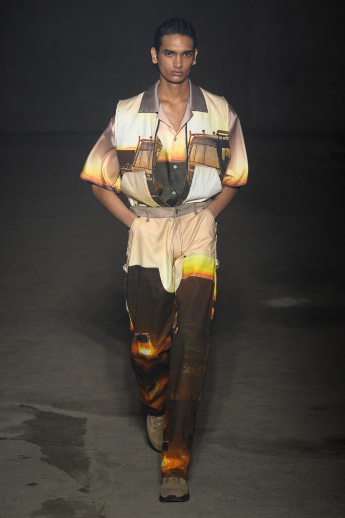 A relaxed multicolor cotton jumpsuit with a collared neckline and short sleeves, featuring a unique printed design.