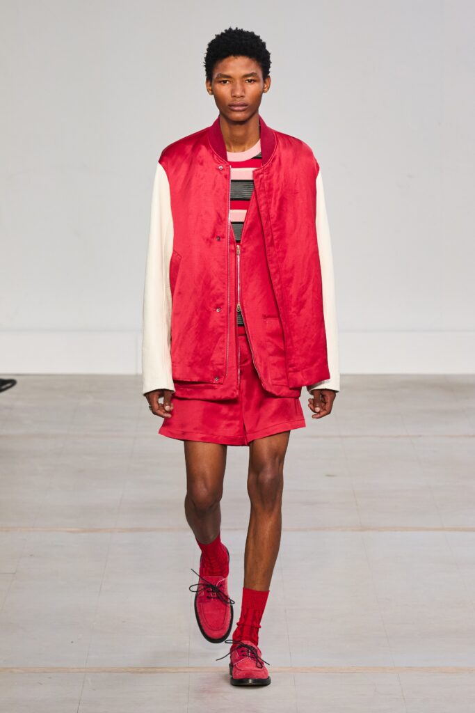 A relaxed red and white jacket paired with matching shorts, featuring a color-blocked design.