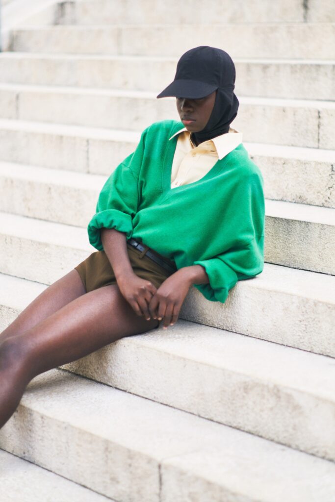 green relaxed sweater with yellow shirt