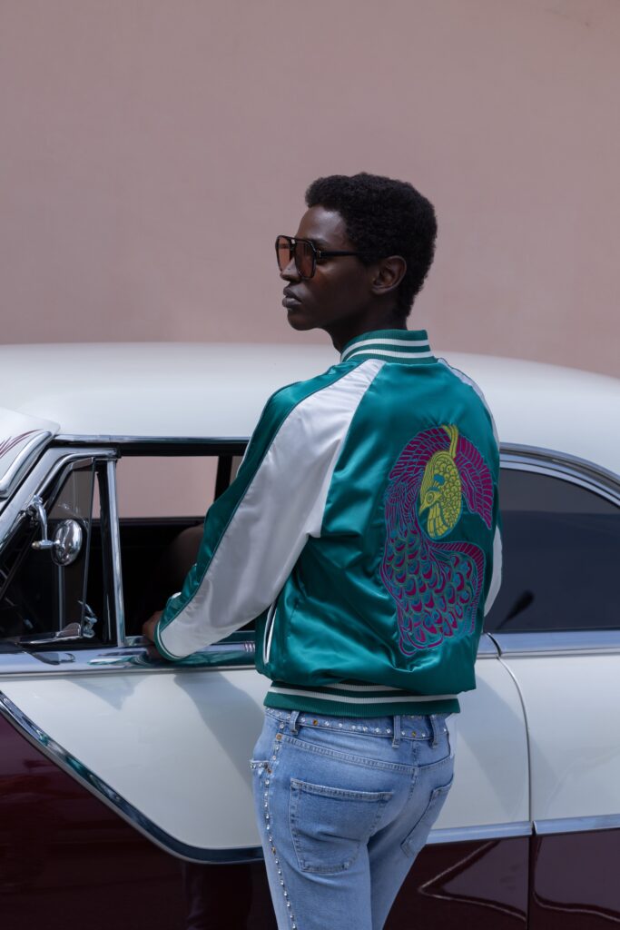 teal embroidered jacket with jeans