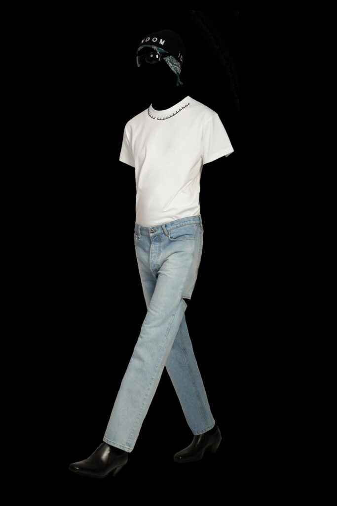 A fitted white t-shirt with a collared design paired with straight-leg blue jeans.