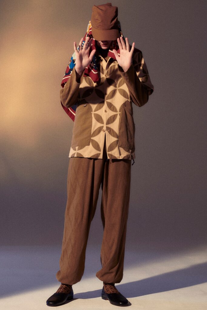 A relaxed-fit brown cotton jacket with printed design paired with matching pants.