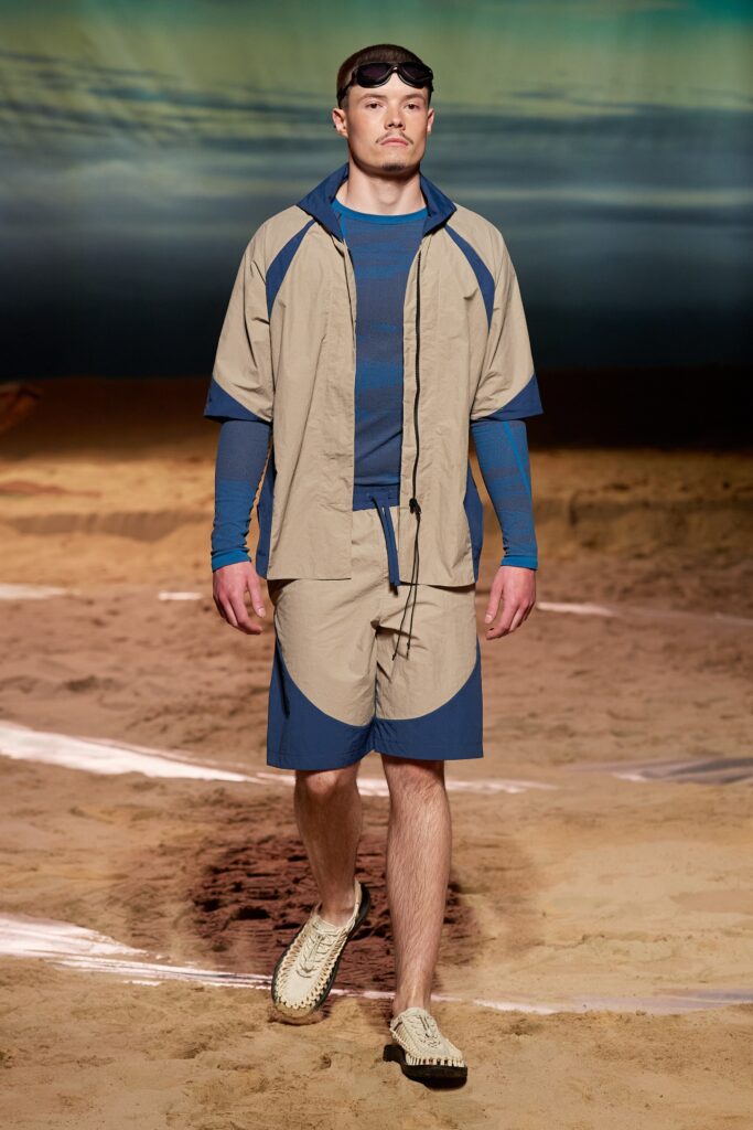 A relaxed beige and blue color-blocked shirt paired with matching shorts.