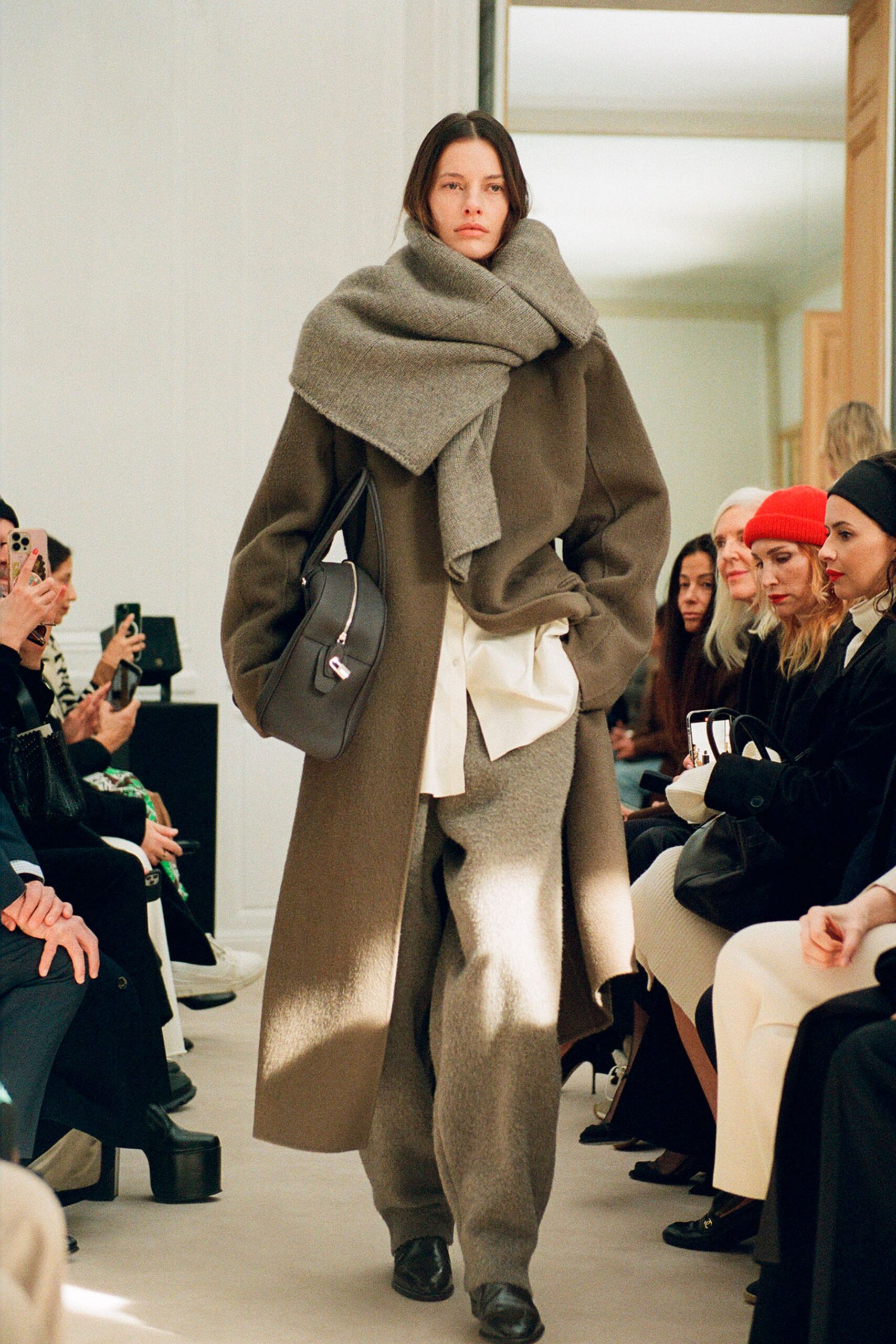 A relaxed gray wool coat paired with matching pants, featuring a layered look.