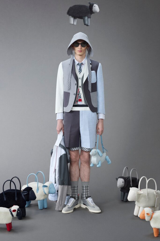 A relaxed gray checked jacket paired with matching shorts, featuring a layered design.