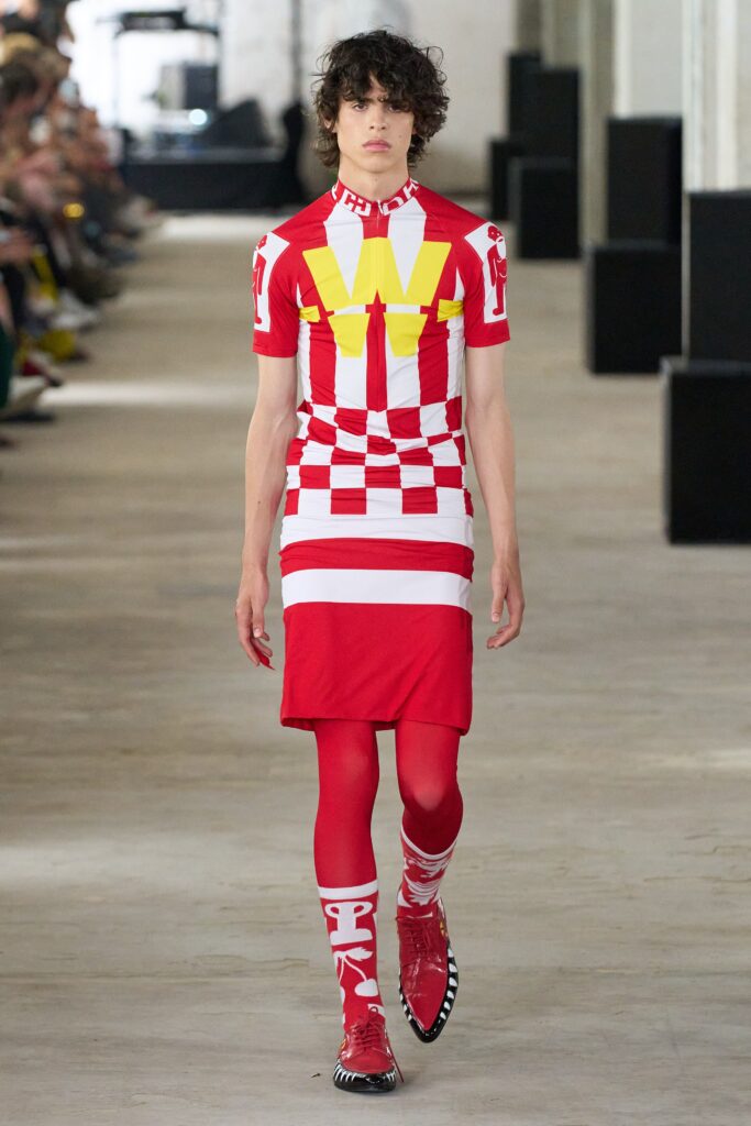 A fitted red and white striped dress with short sleeves and a V-neckline.