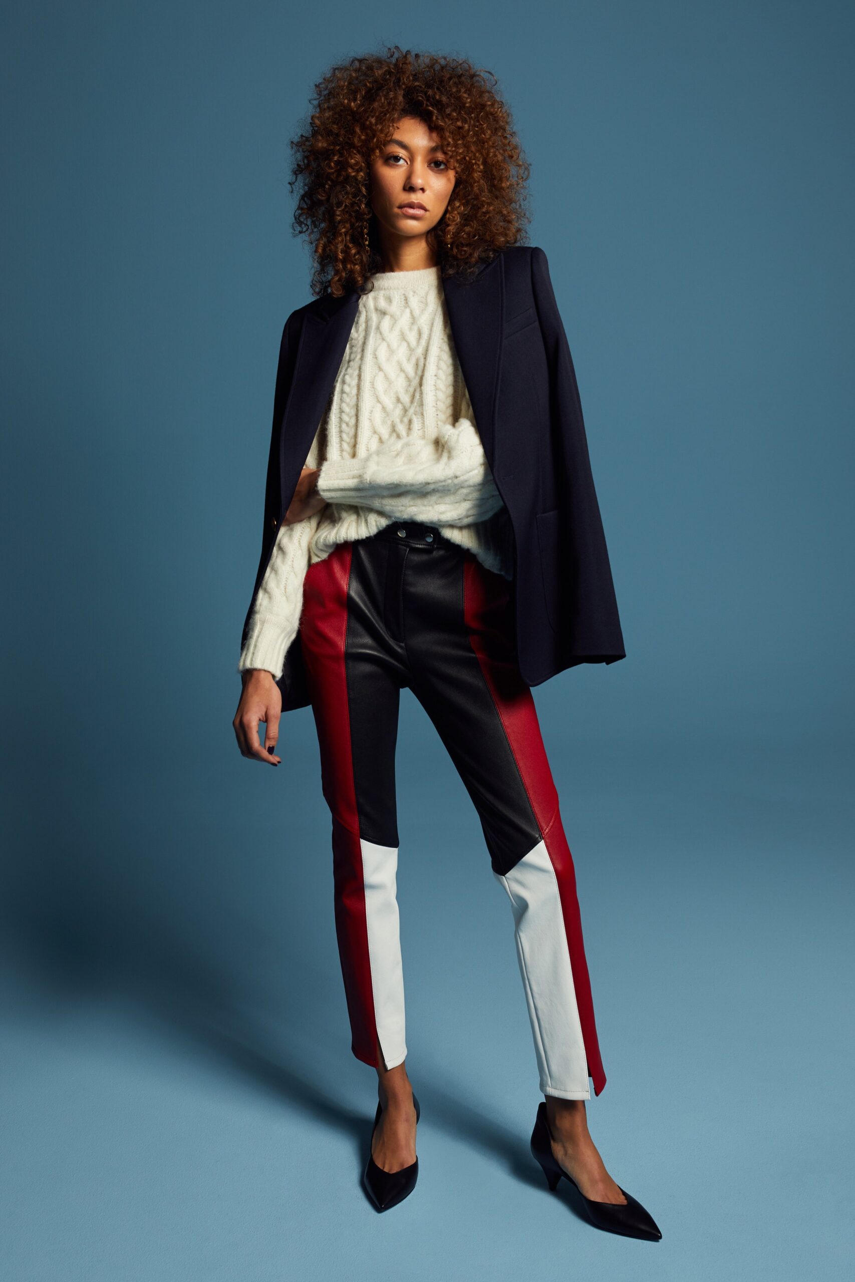 black tailored blazer with ivory sweater
