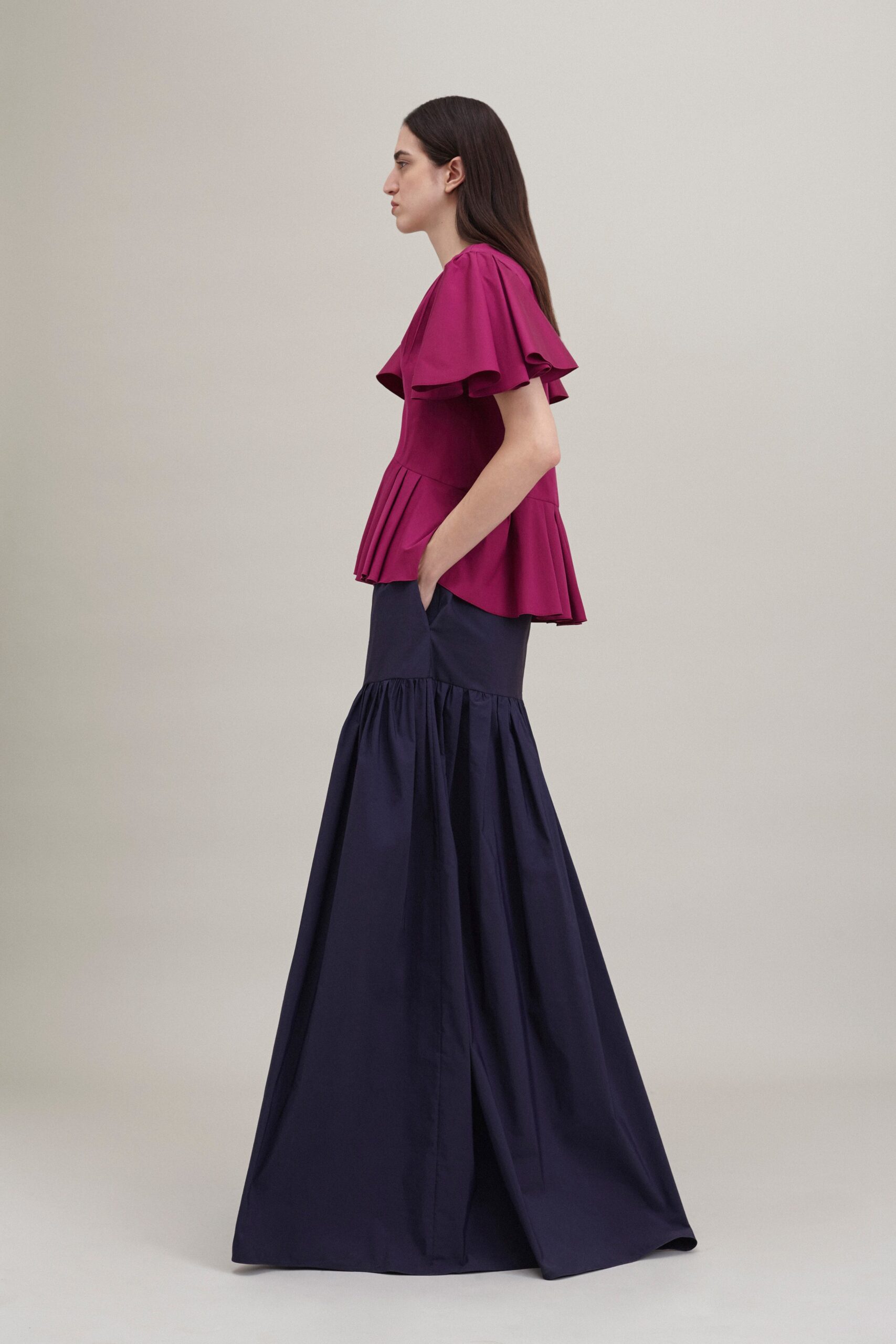 pink ruffled top with blue flared skirt