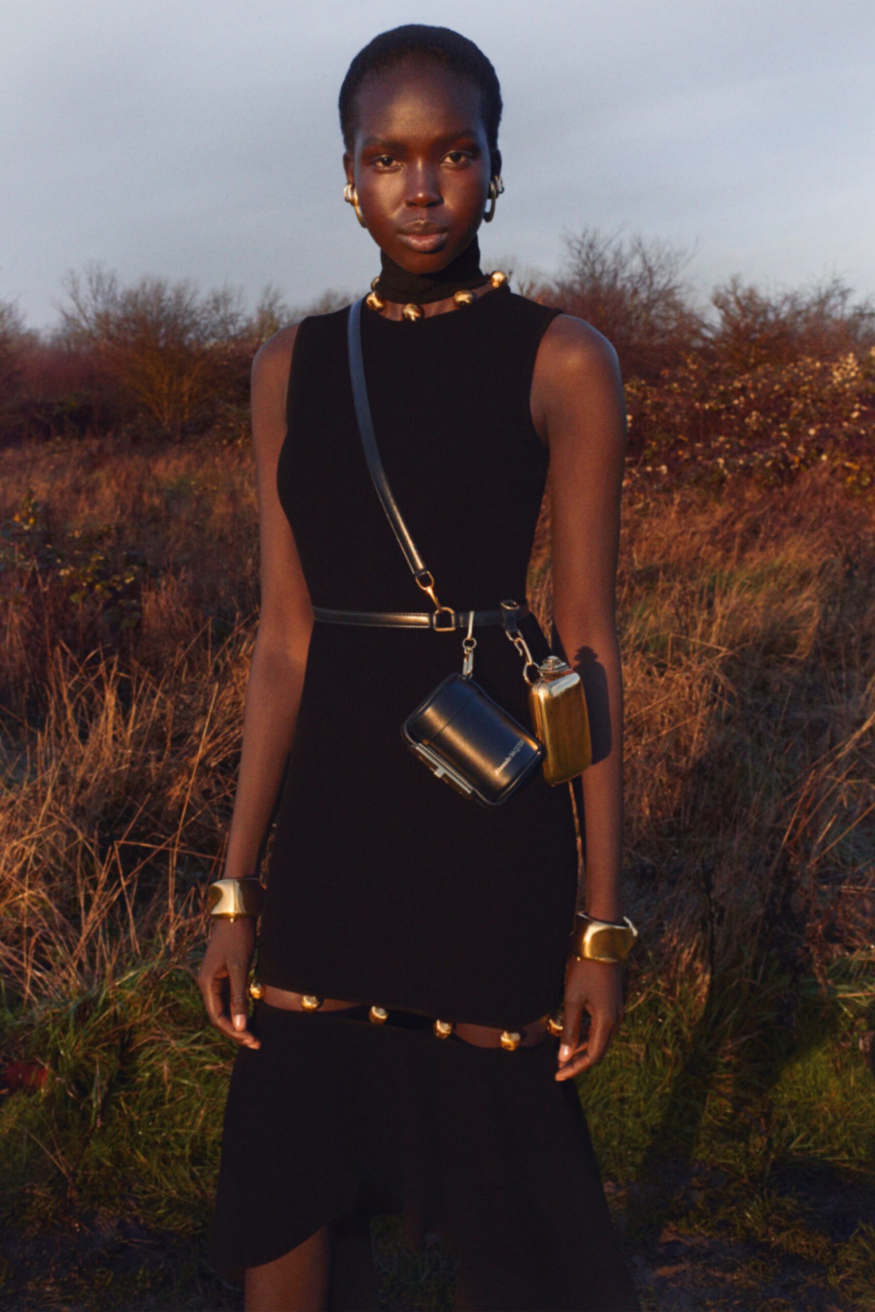 black knit sleeveless high-neck fitted tiered midi dress