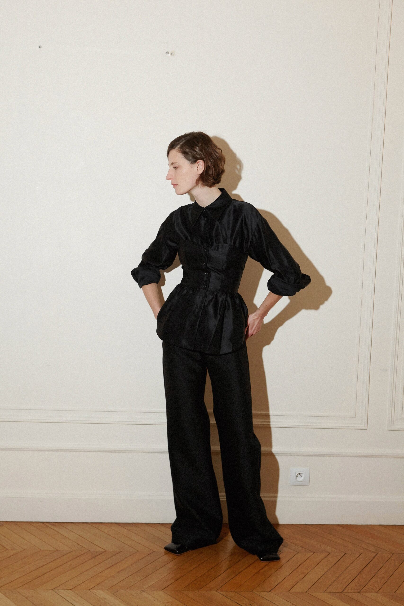 black silk fitted blouse and relaxed pants