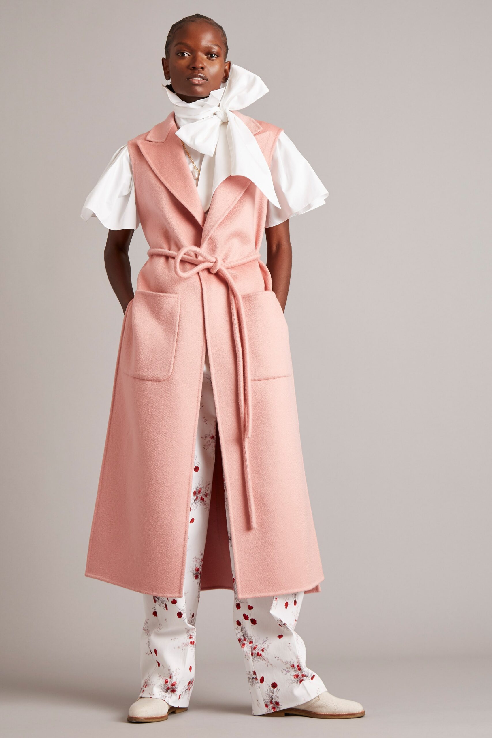 pink wool coat with white blouse